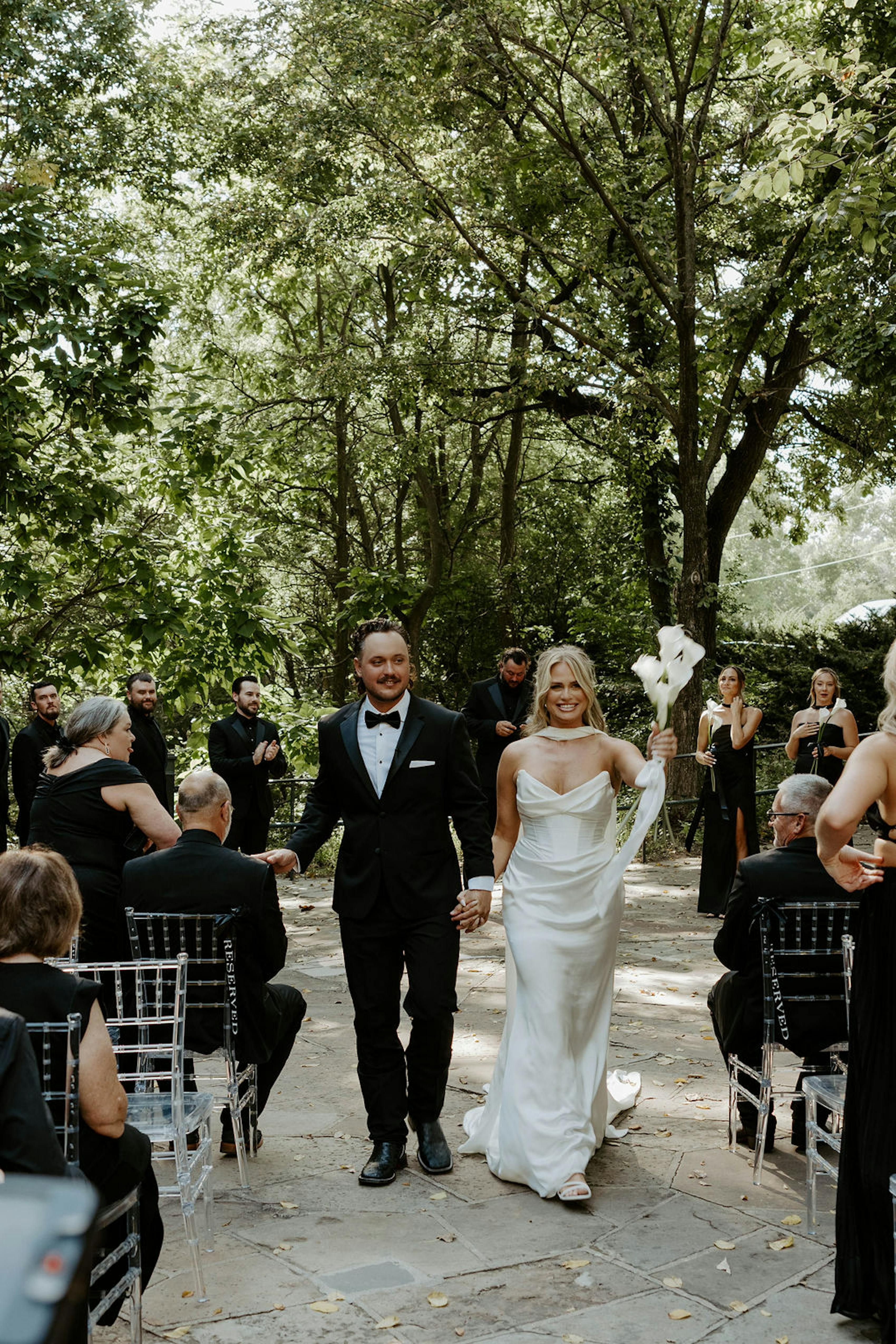 outdoor castle garden wedding in Omaha with trendy attire