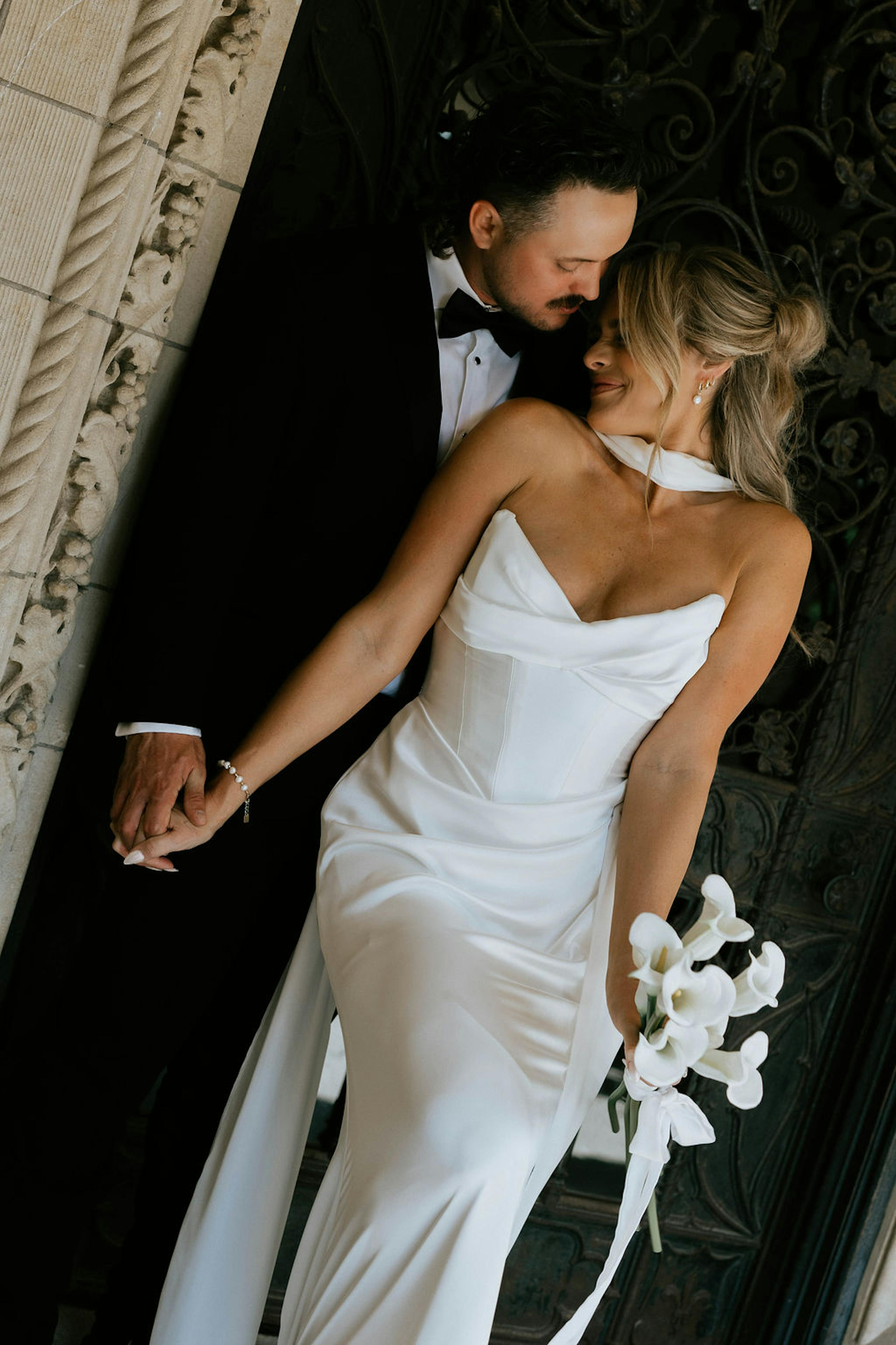 black tie bride and groom attire with neck scarf bridal gown and wedding tux
