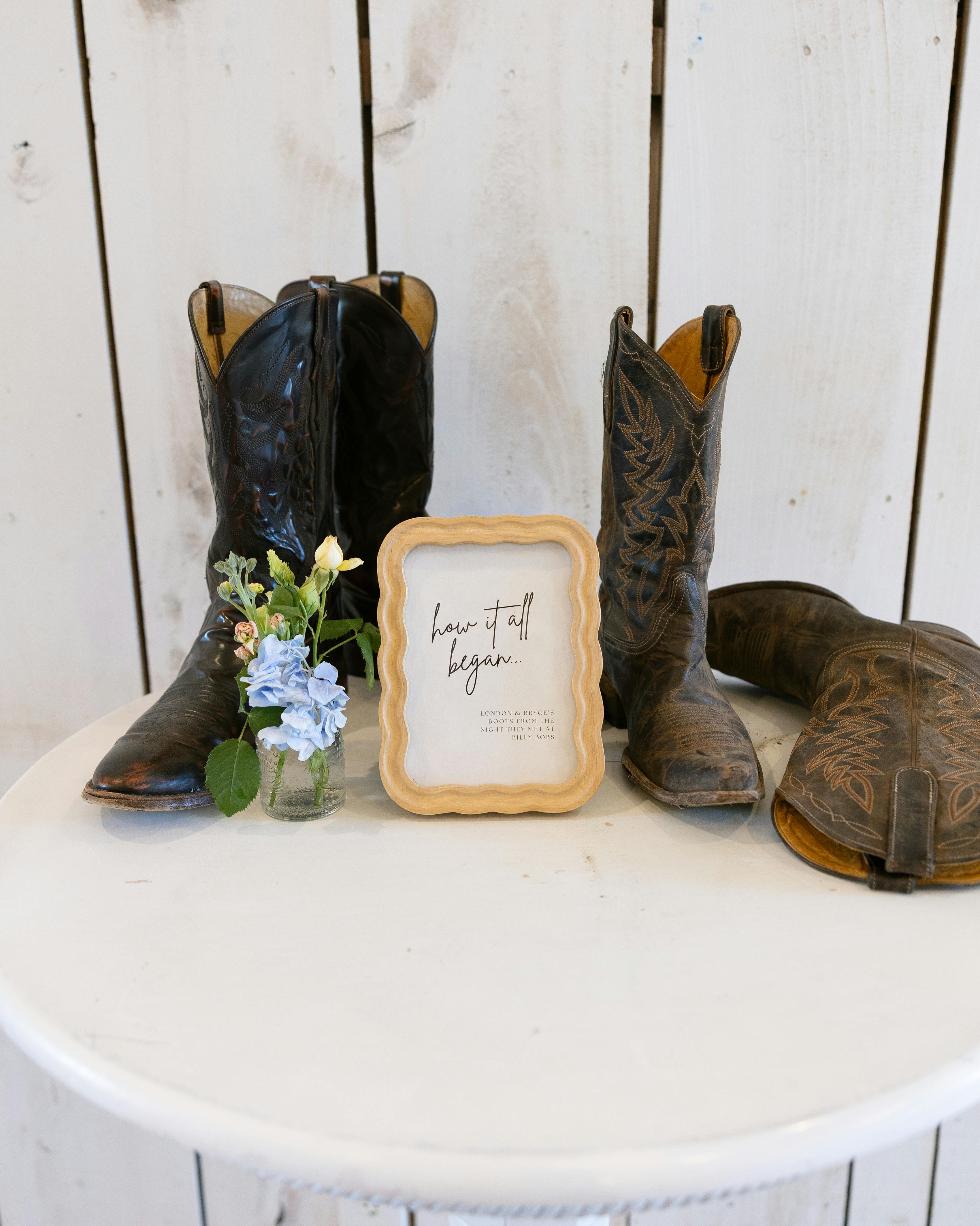 Cowboy boot decorations at rustic barn wedding