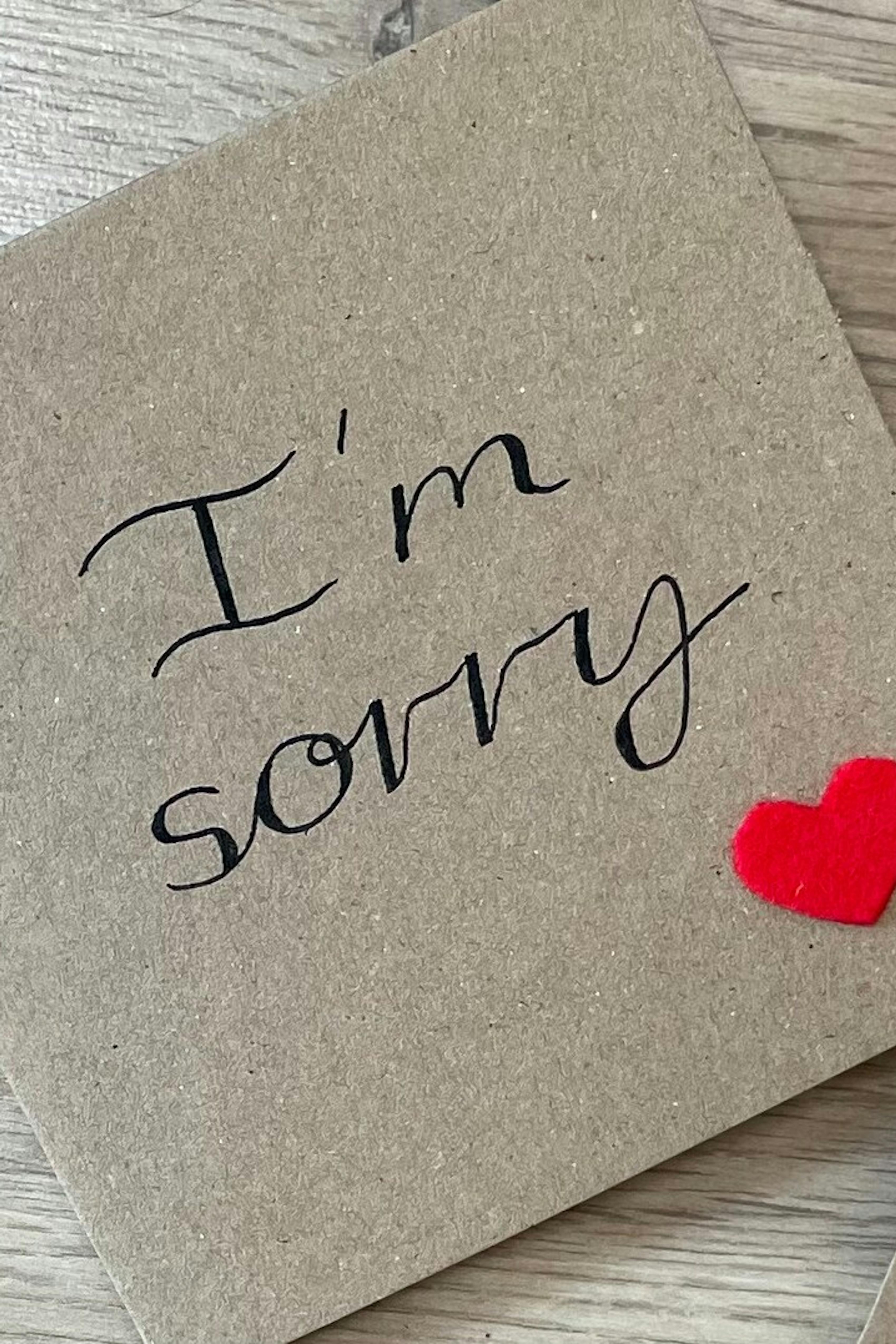 Handmade I'm Sorry card on natural paper with red heart