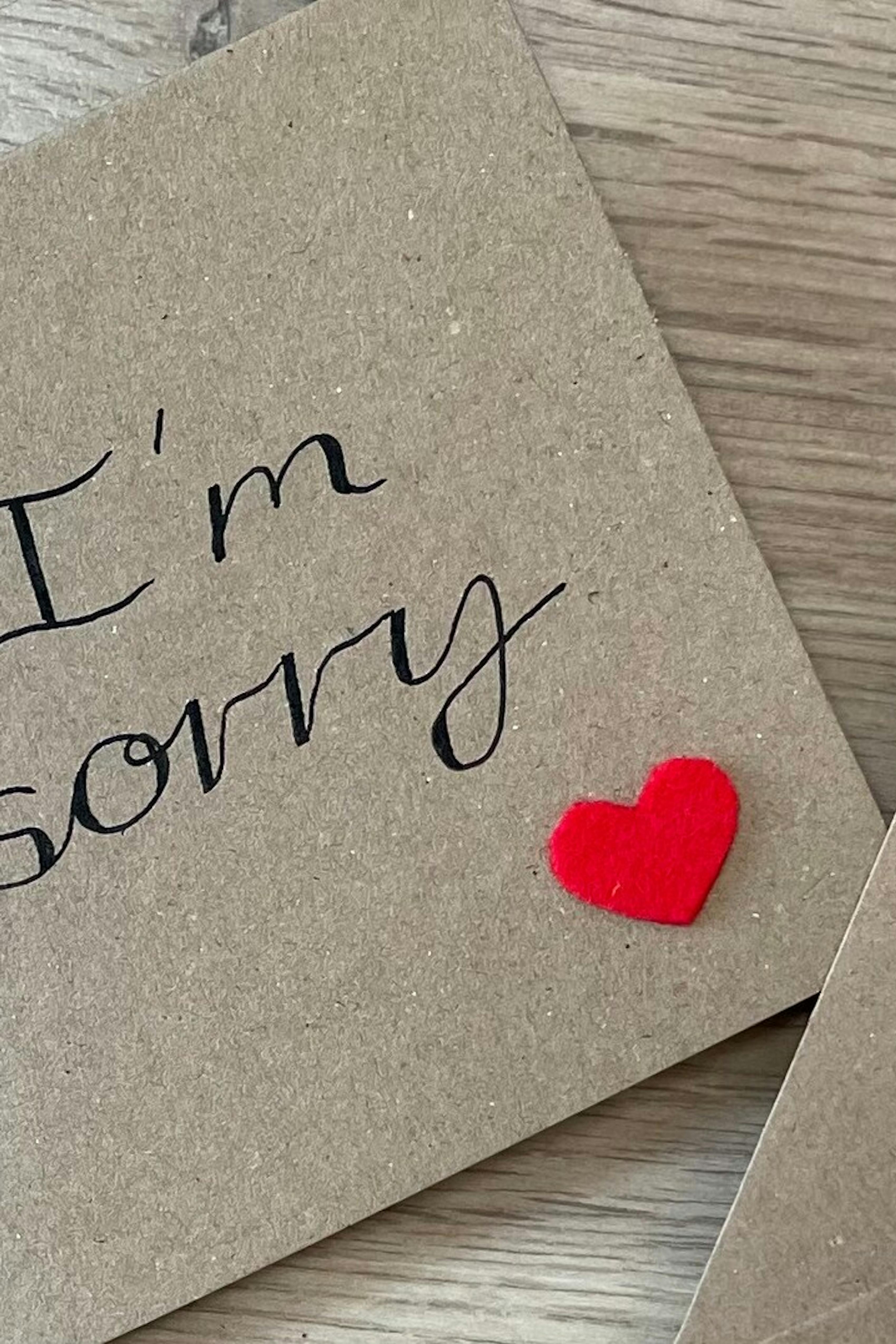 Handmade I'm Sorry card on natural paper with red heart