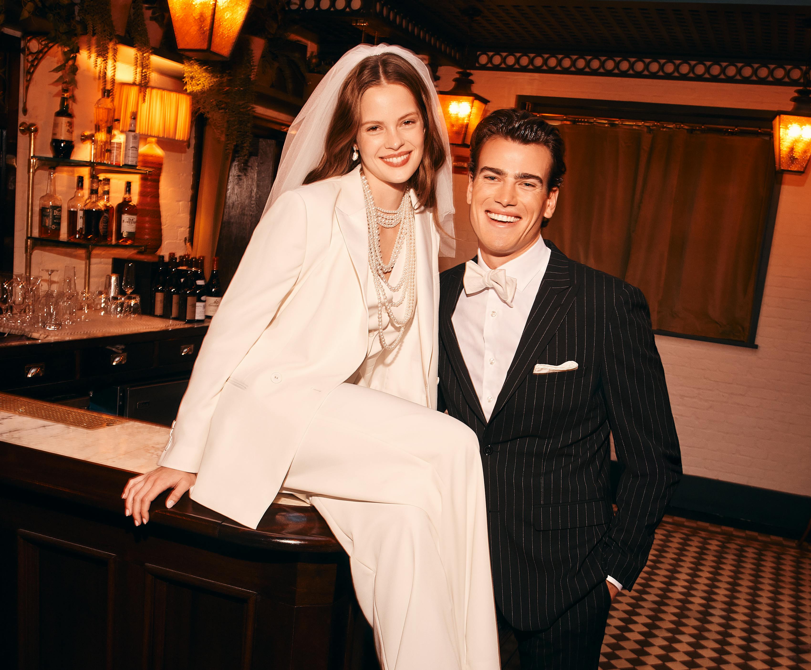 Bride and groom halloween costume with women's white suit and men's black tuxedo