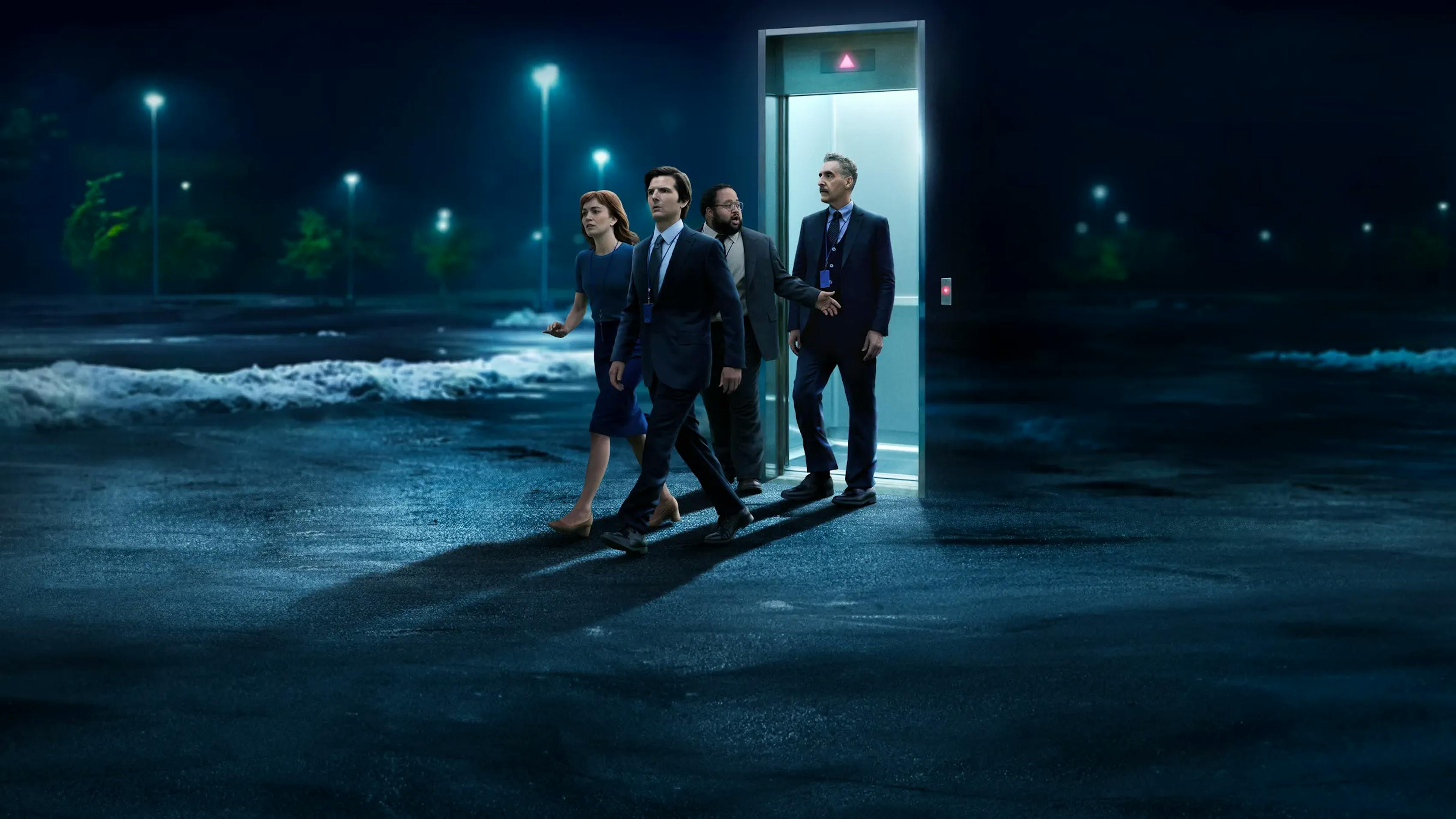 Mark, Helly, Dylan, and Irving walking out the door into the parking lot in Severance Season 2