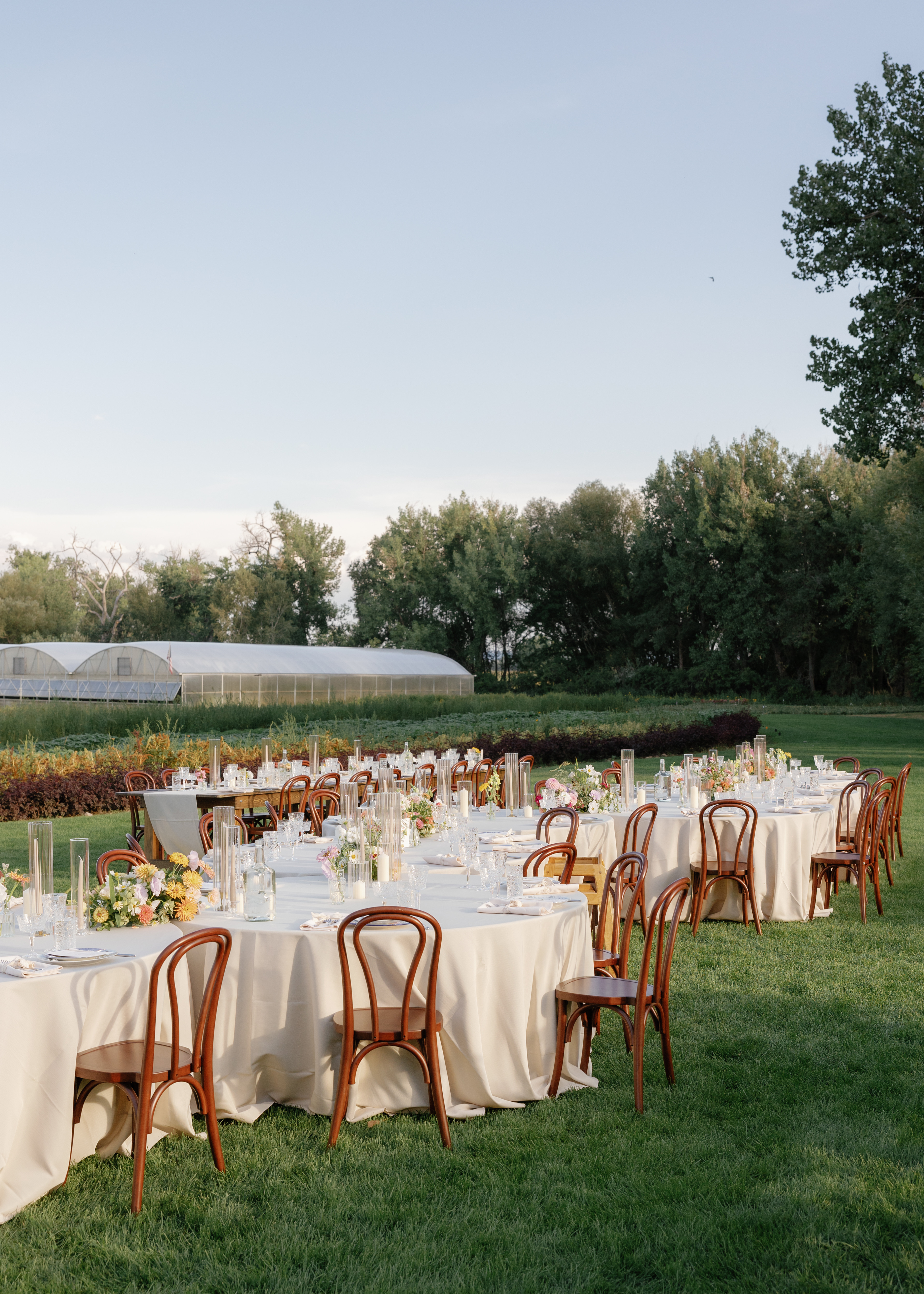 Summer outdoor farm wedding with modern rustic tablescapes and simple rental setup