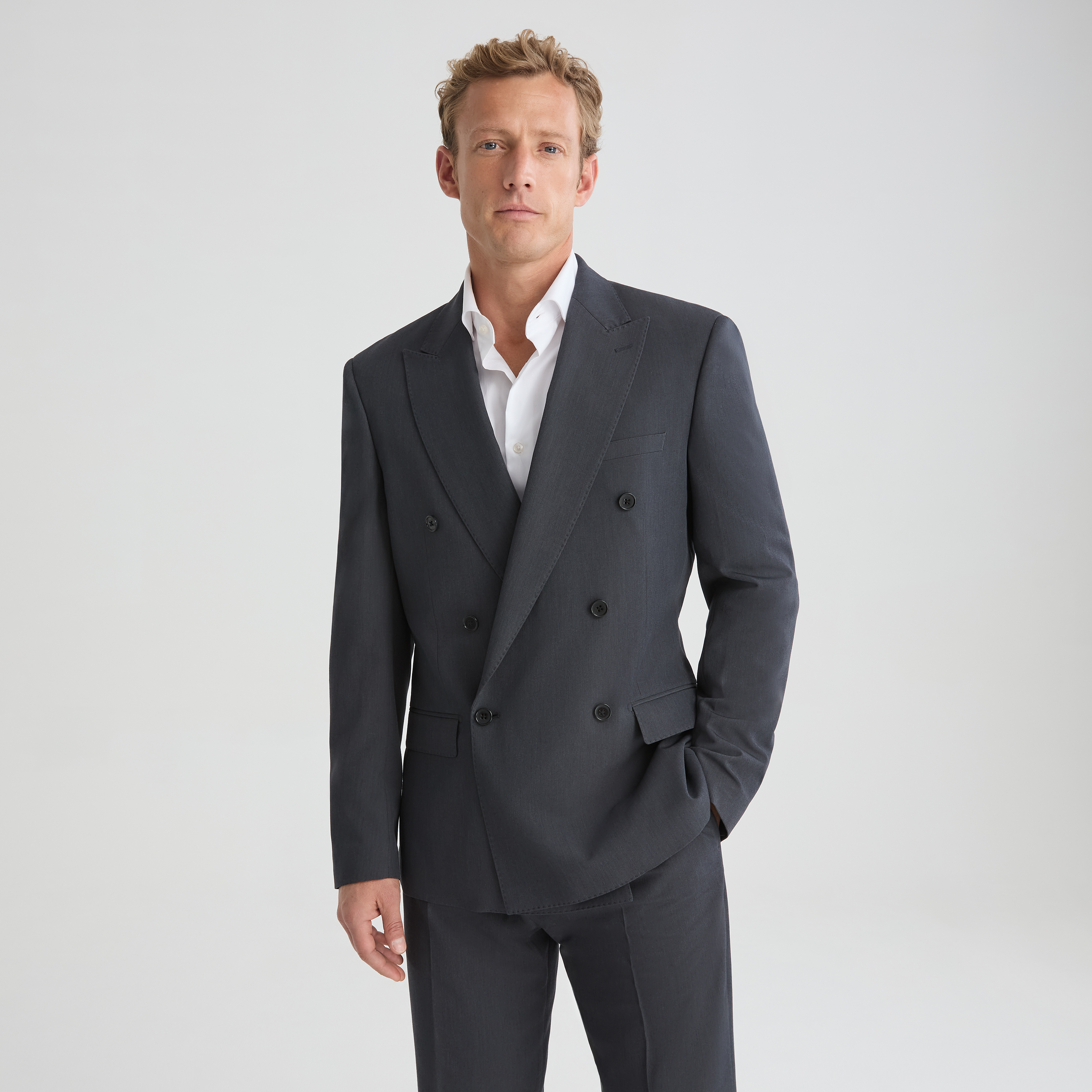 Charcoal grey relaxed double breasted suit jacket for men with wide leg dress pants