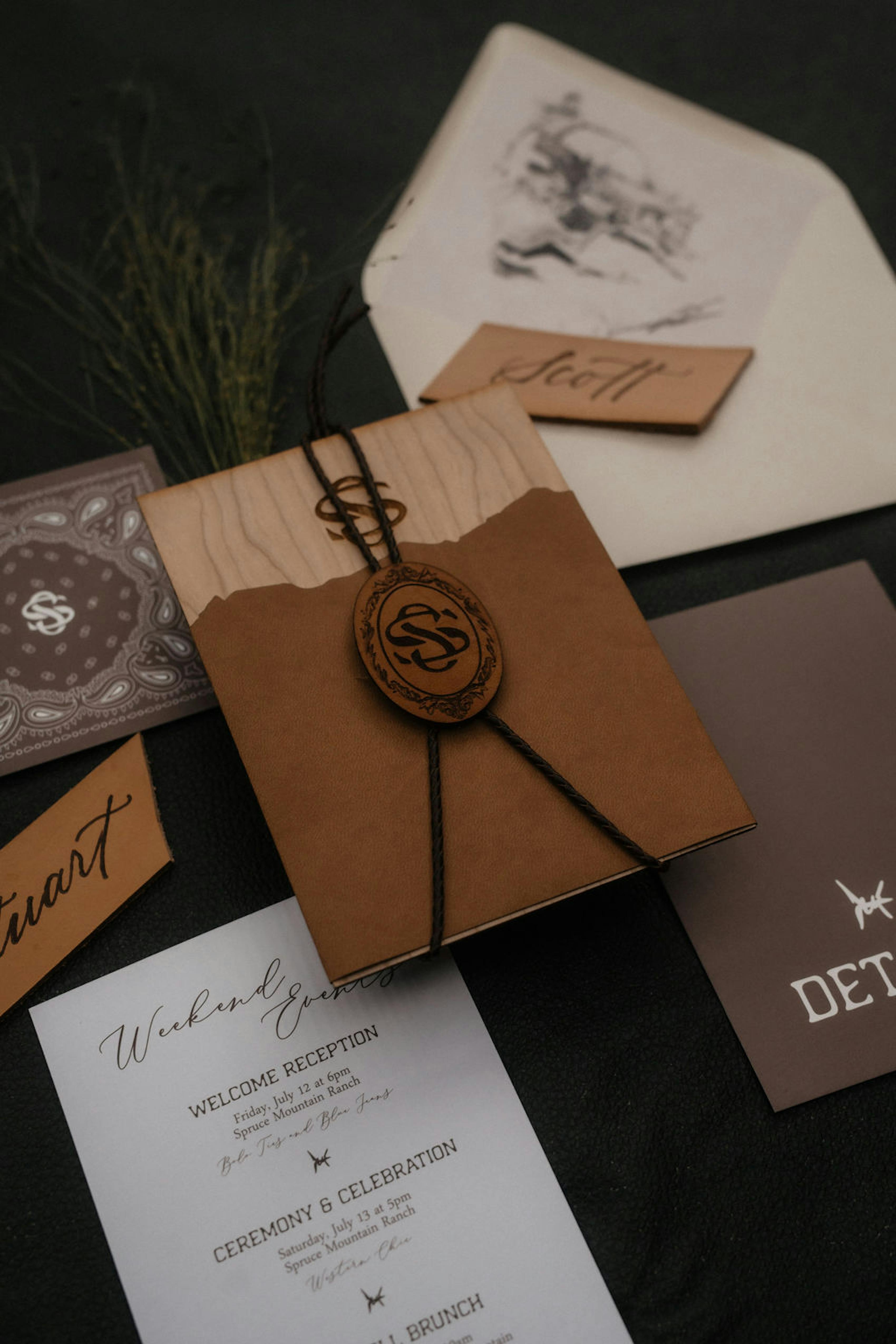 Dark brown wedding stationary with western theme and bandana print