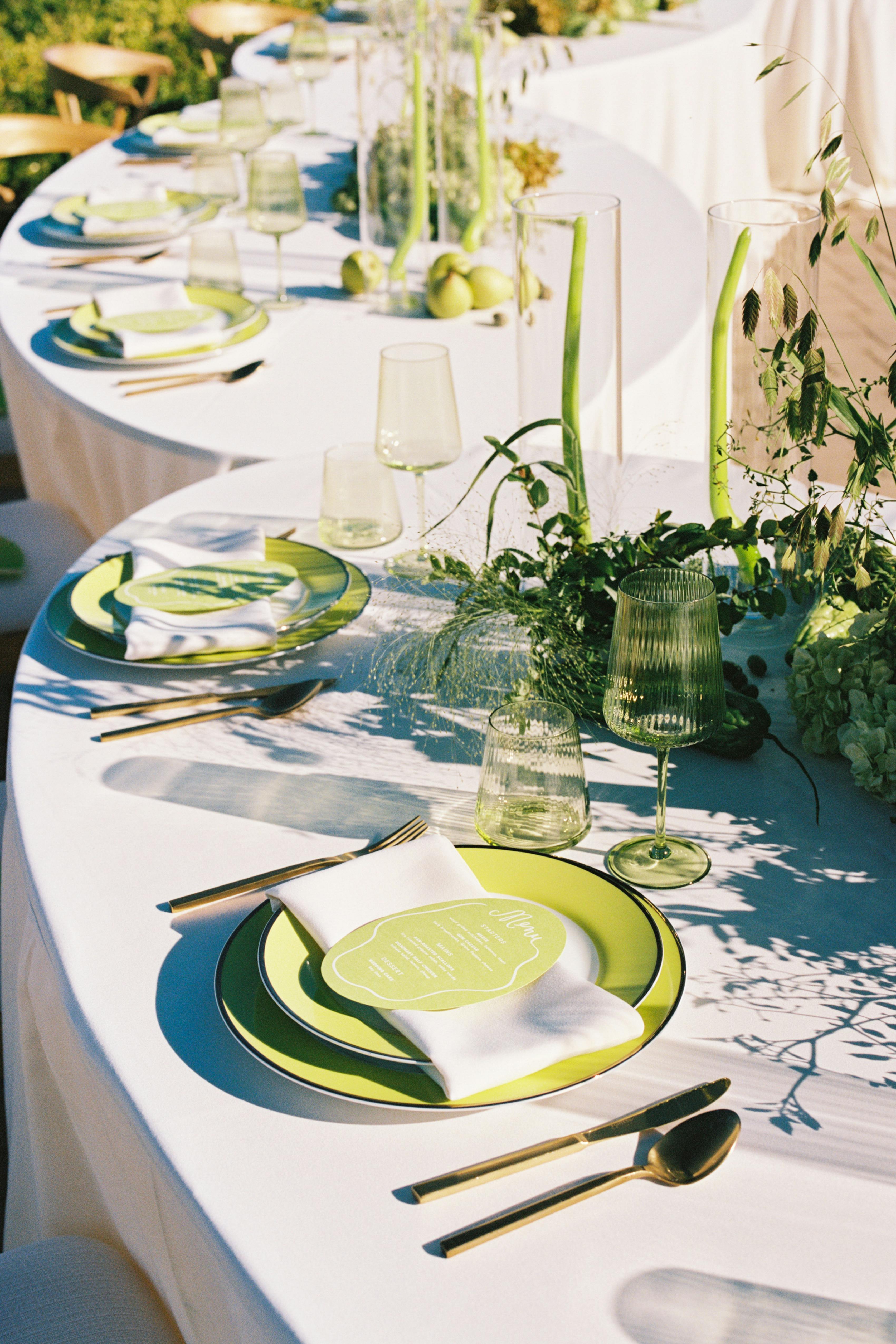 Subtle white and lime green wedding tablescape with large round seating plan