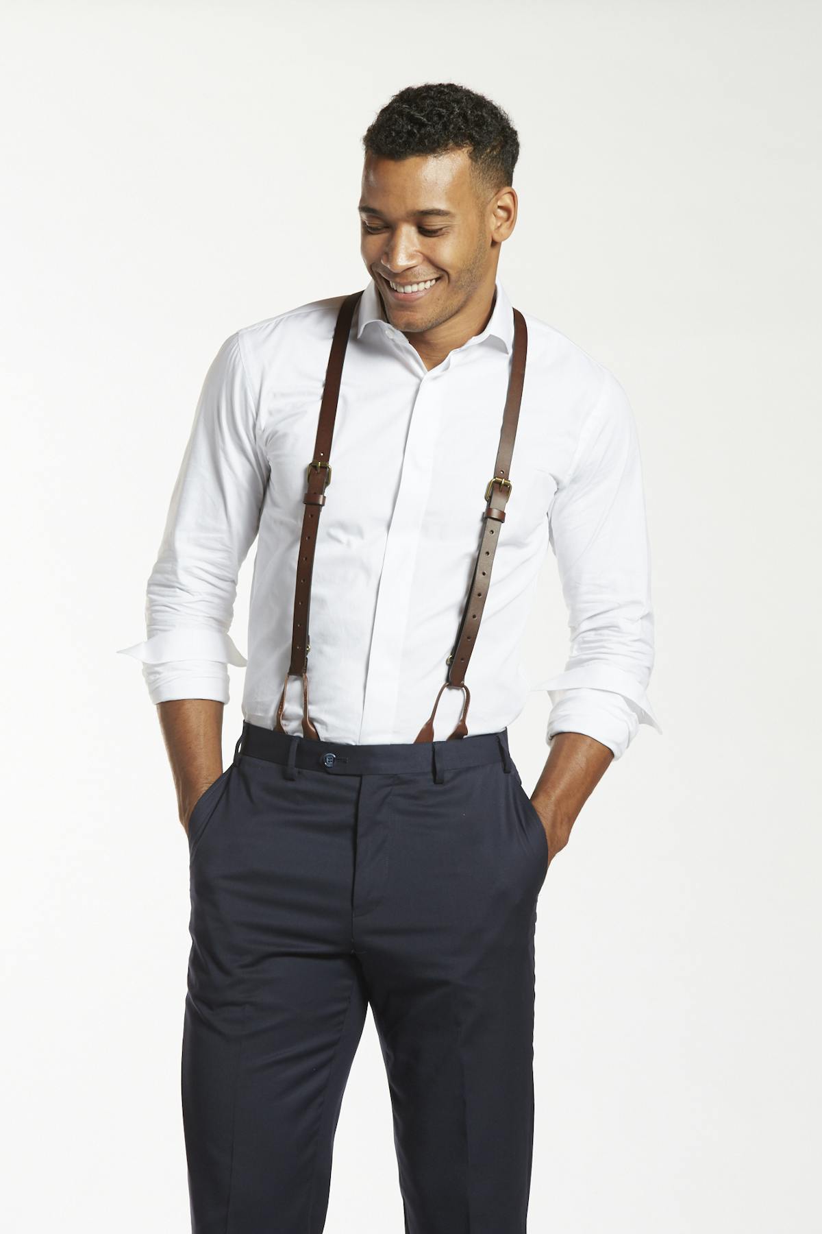 Formal Man In Shirt And Bow Tie Adjusting His Suspenders For A