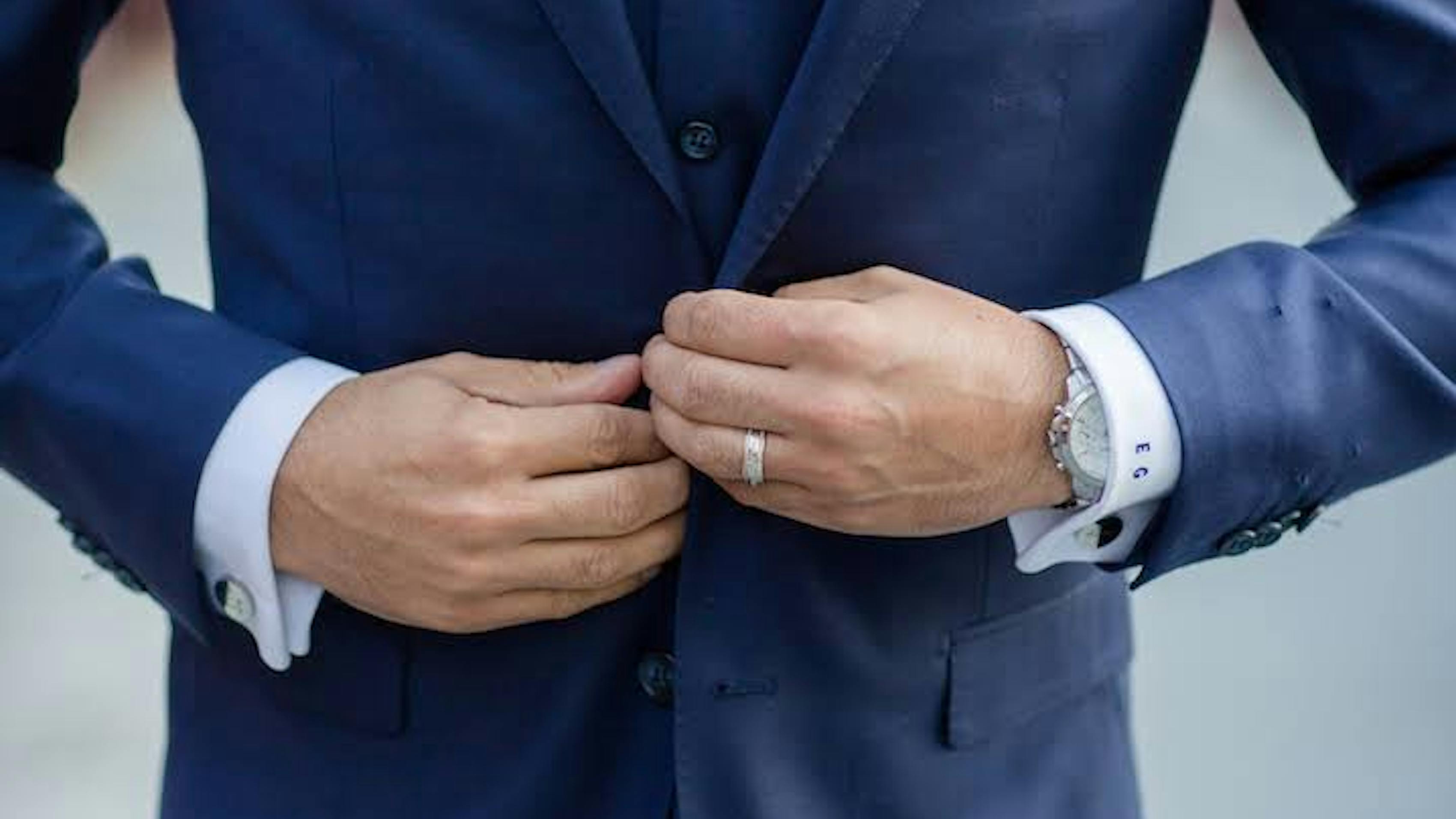 Rules and how to's for buttoning your wedding suit or tuxedo and vest for men.