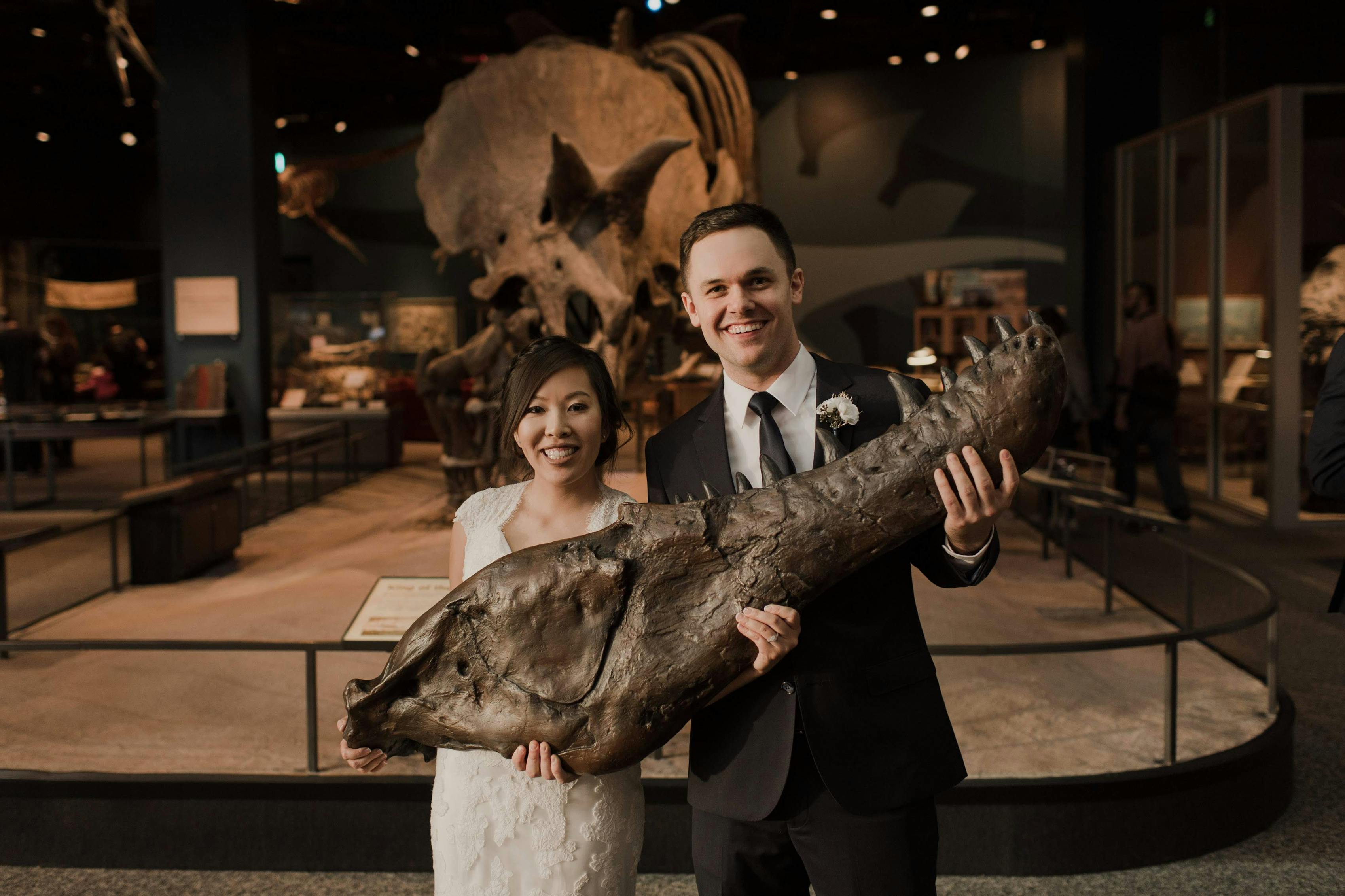 Alternative couple at wedding reception at natural history museum wedding venue.