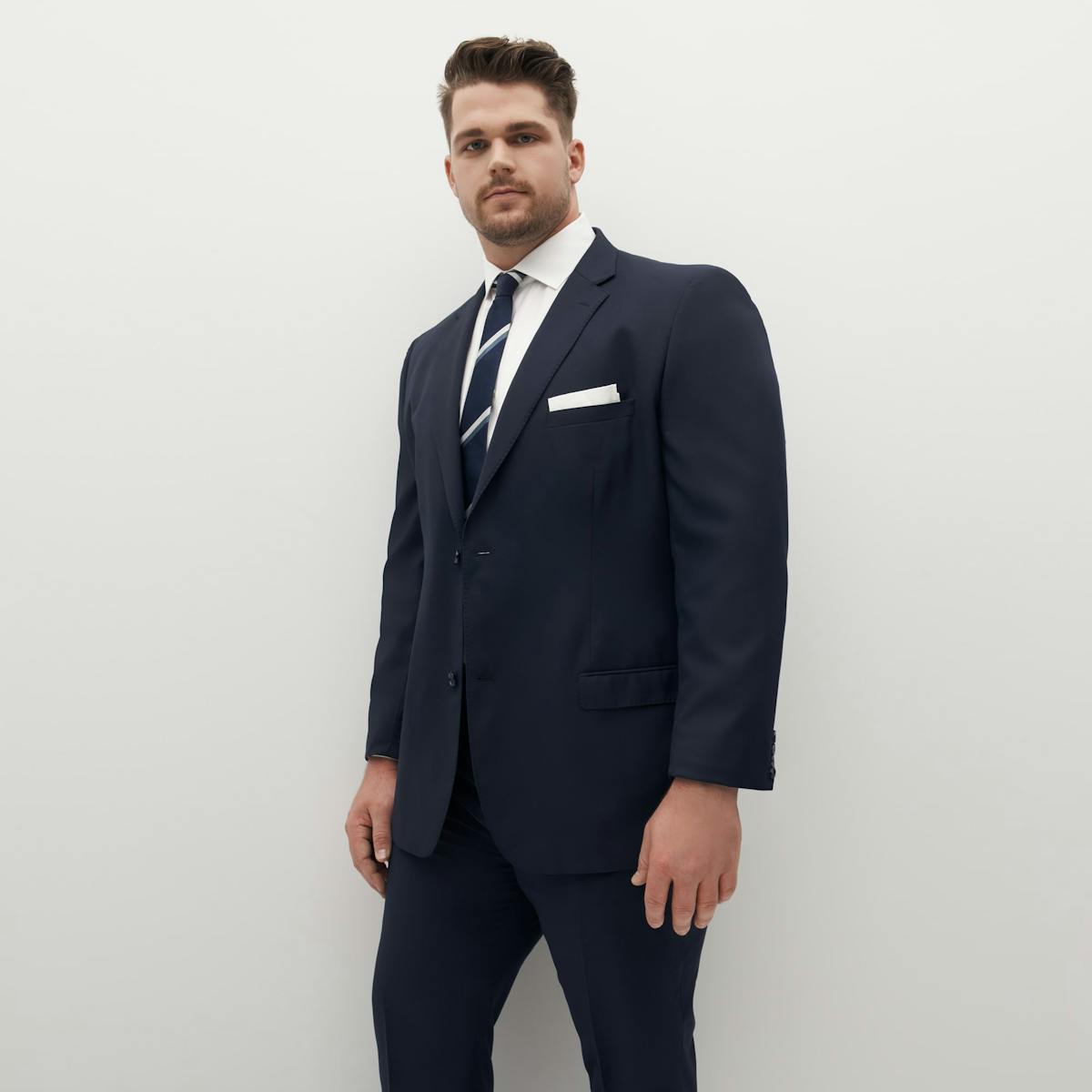 This navy blue suit on a big and tall man is perfect for a wintertime night out.