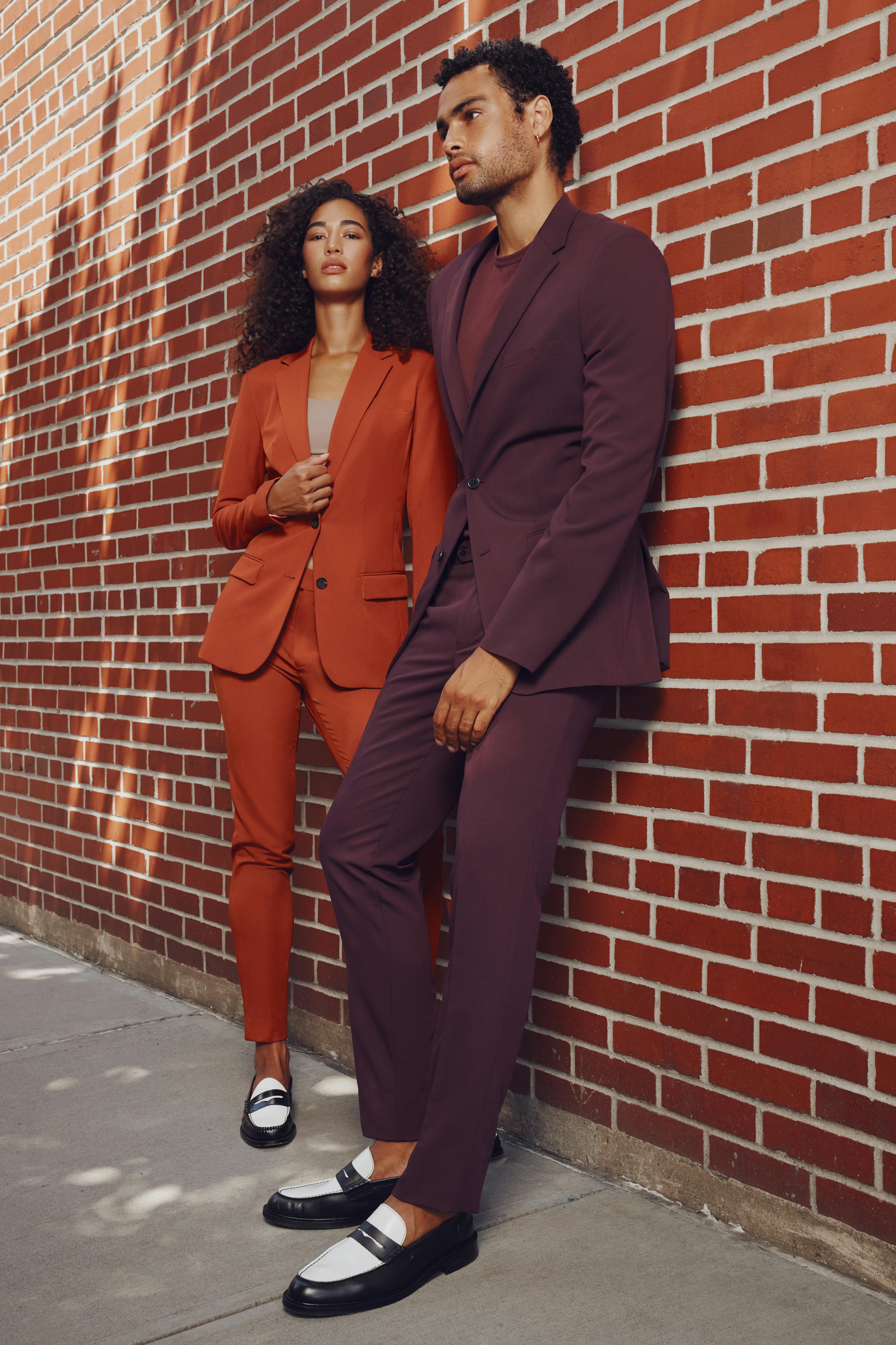 Burnt Orange women's suit and men's burgundy suit.