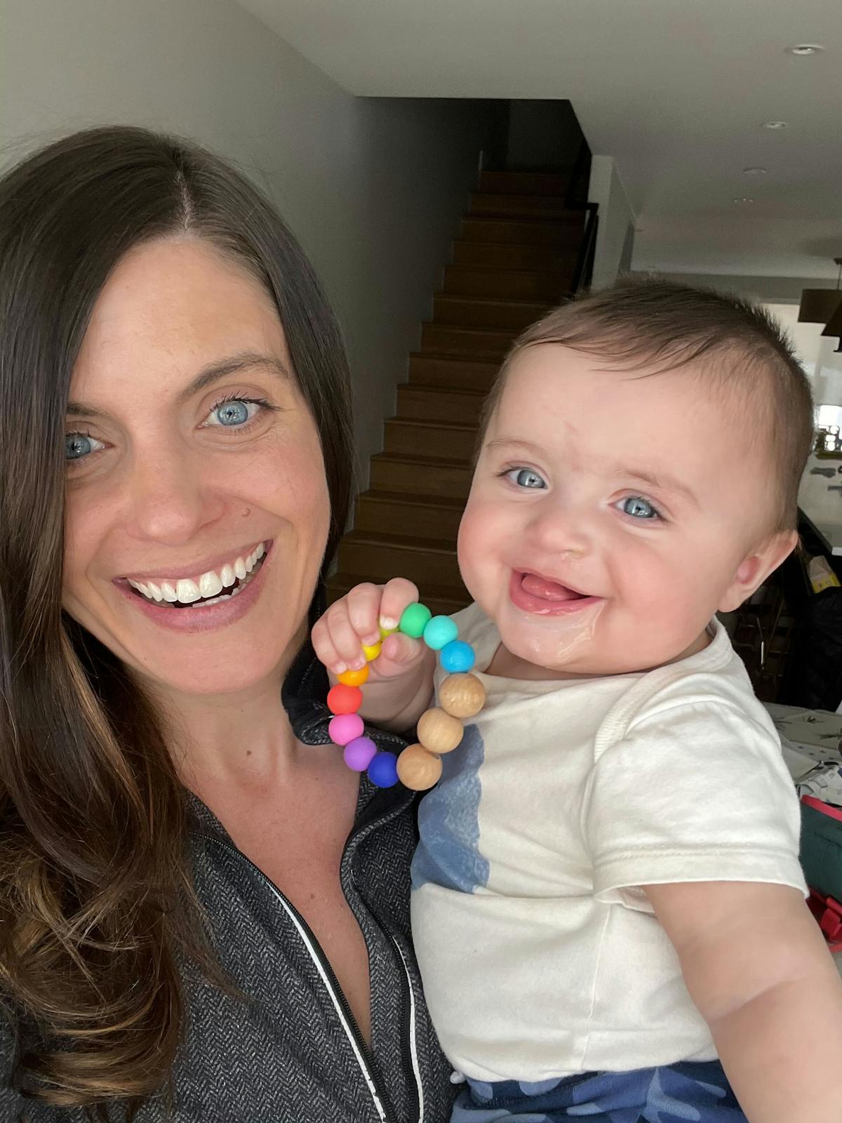 Mom and baby having playtime on their lunch break while working from home