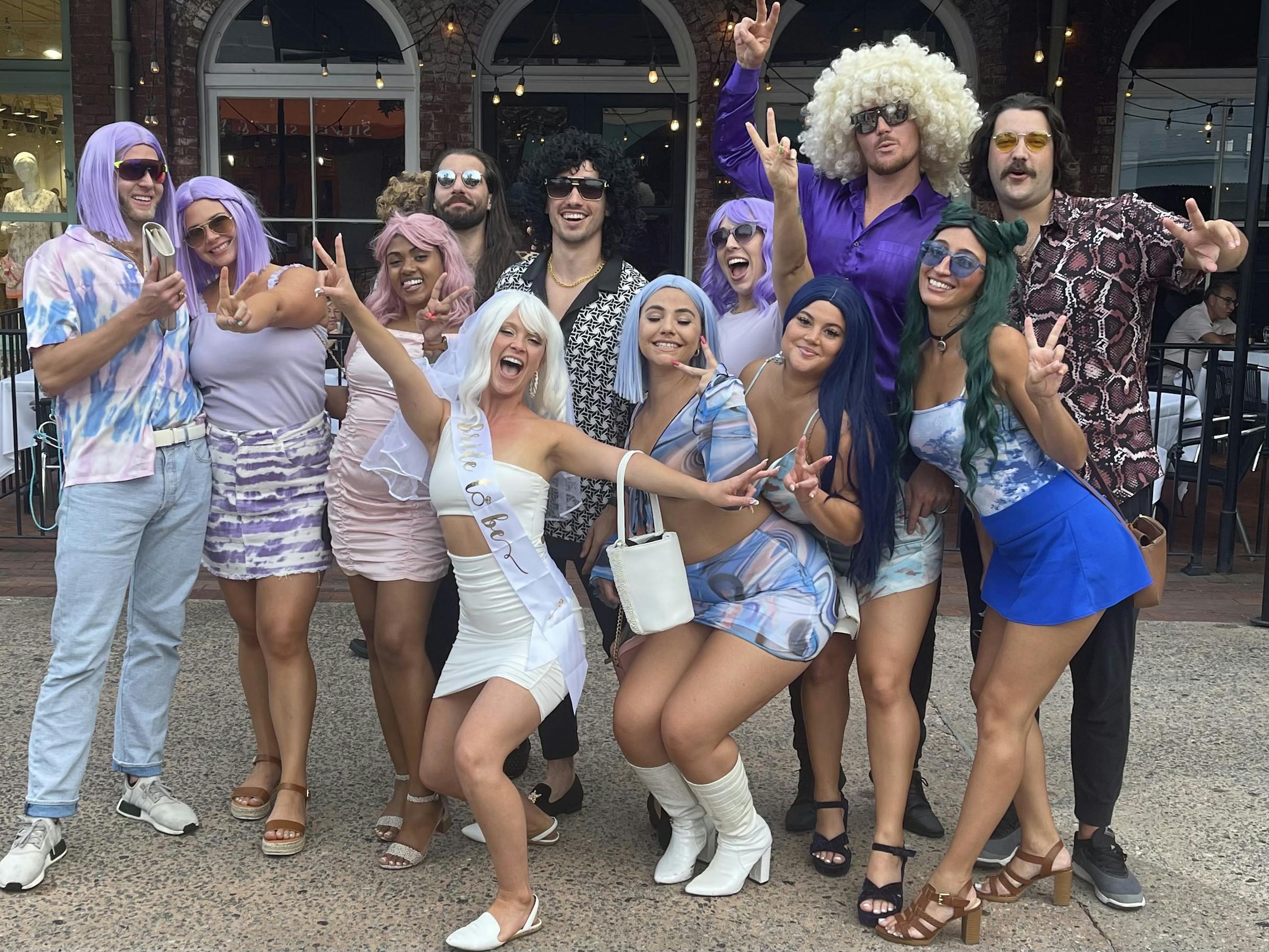 Mix Gendered Bach Bash Dressed Up for Last Disco Bachelorx Theme