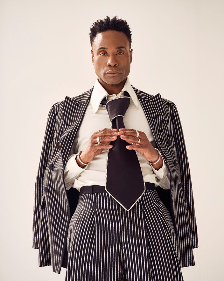 Billy Porter in diamond embellished pinstripe tuxedo and broad statement neck tie.
