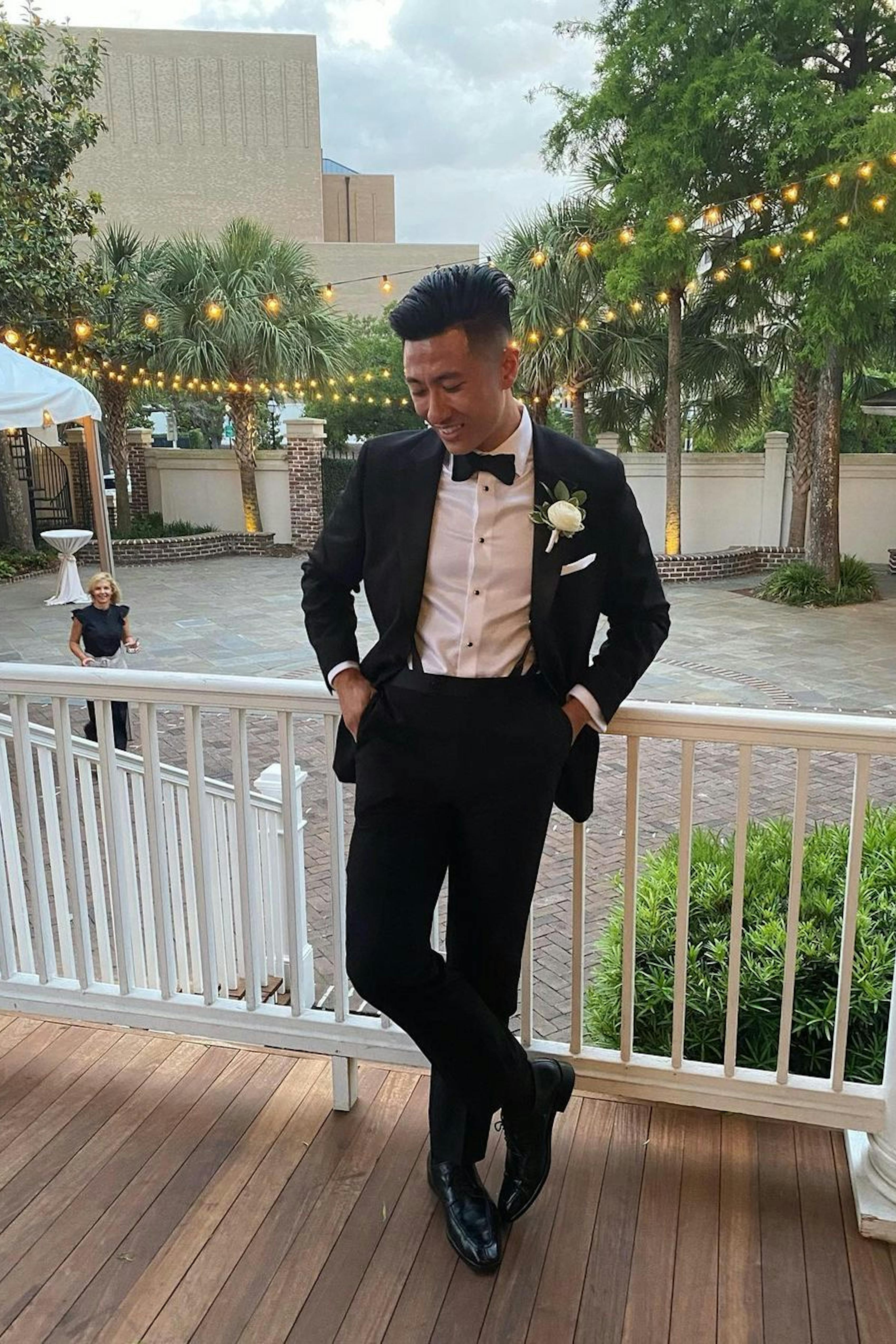Tuxedo and boutonniere outfit at special event.