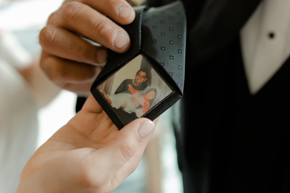 Father of the bride tie with hidden photo to honor loved ones.