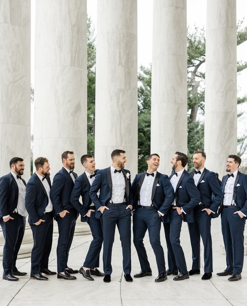 Groomsmen in navy tuxedos  for black tie wedding.