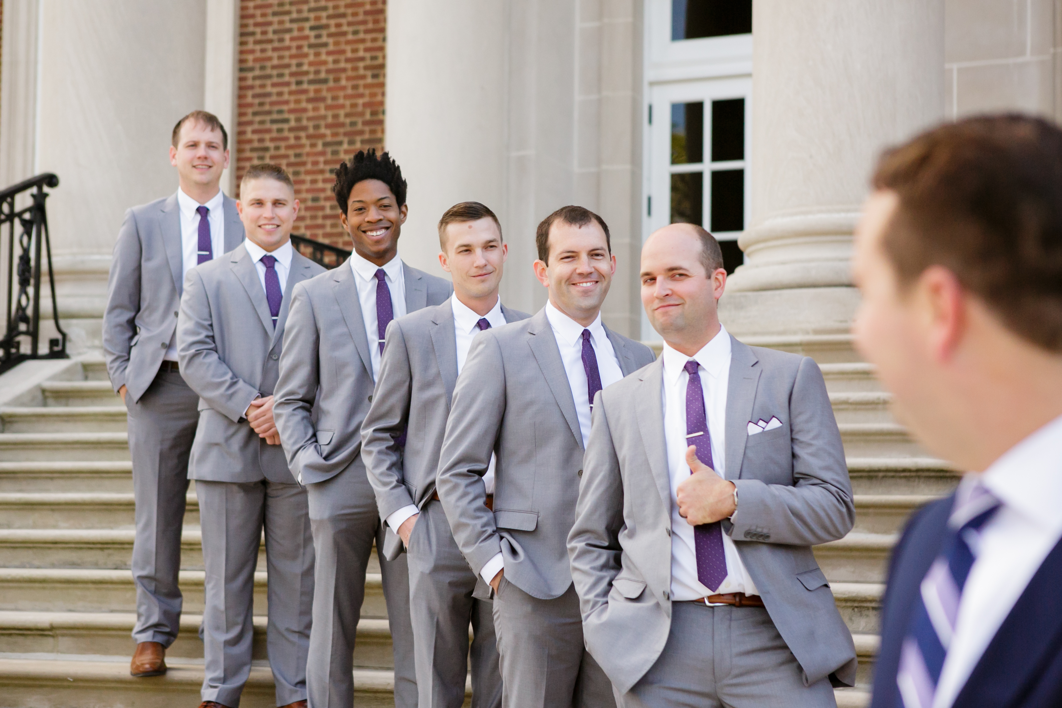 Grey shop groomsmen suits