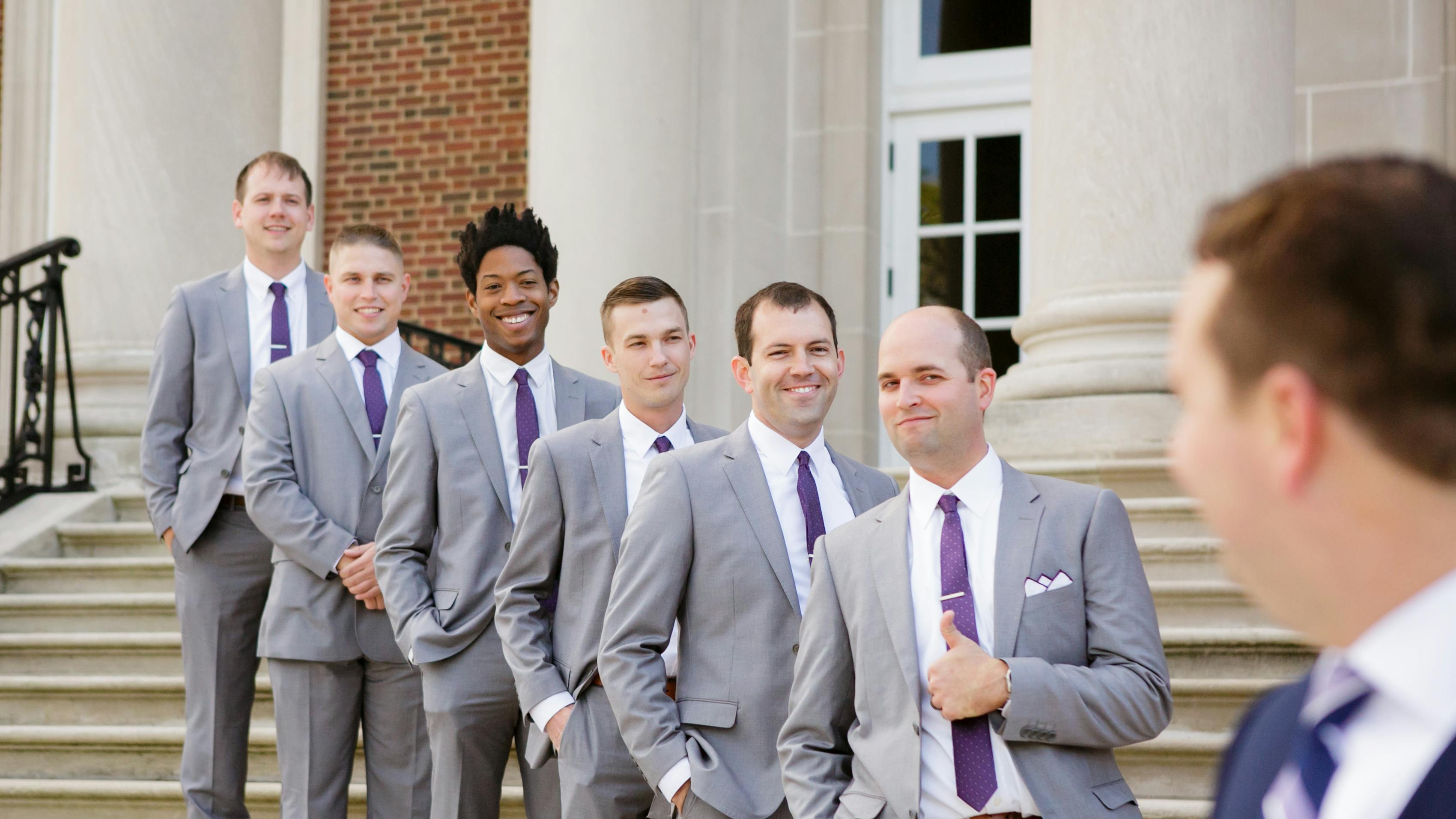 Groomsmen in grey wedding suits