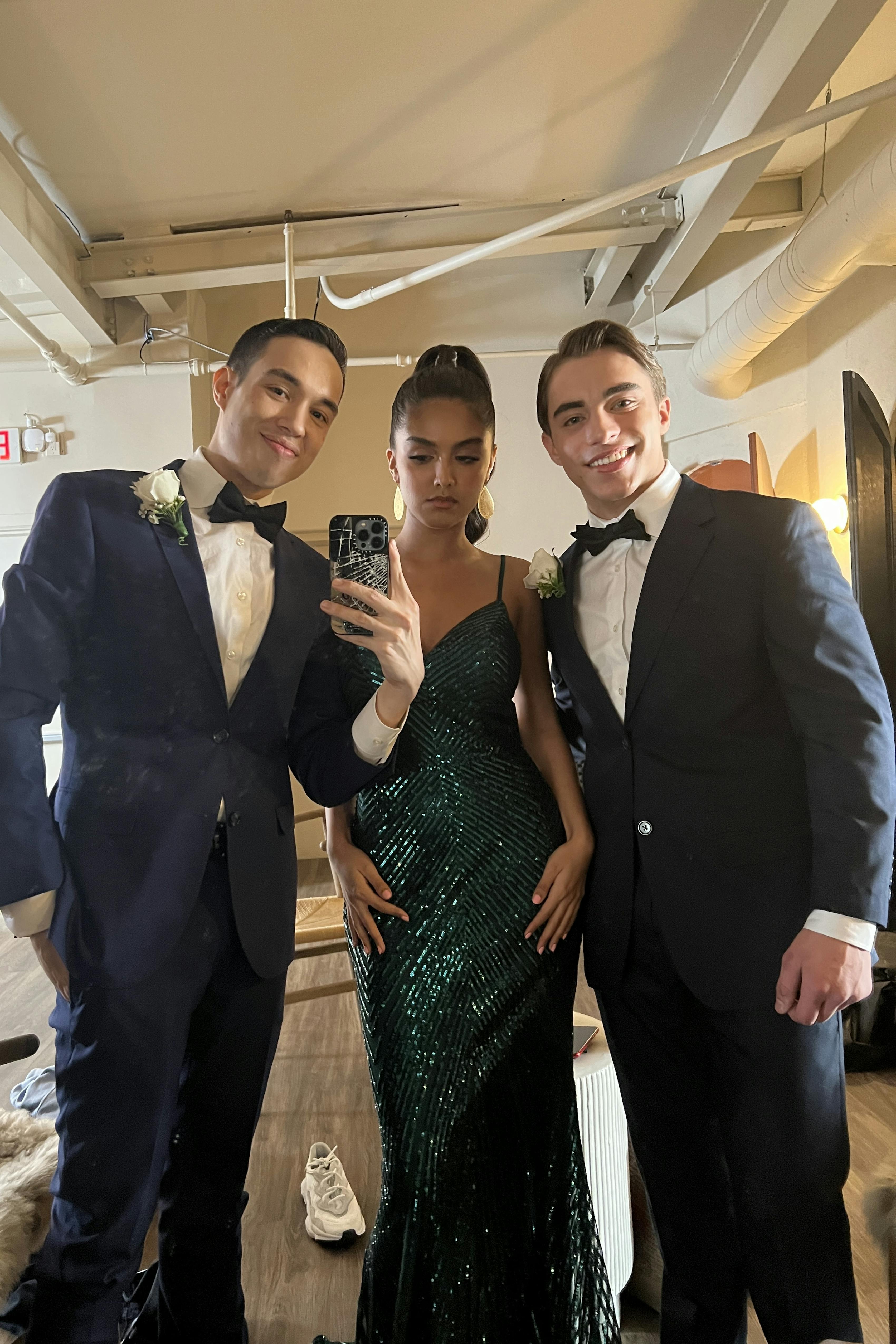 Homecoming selfie with sequin dress and navy suits and bow ties.