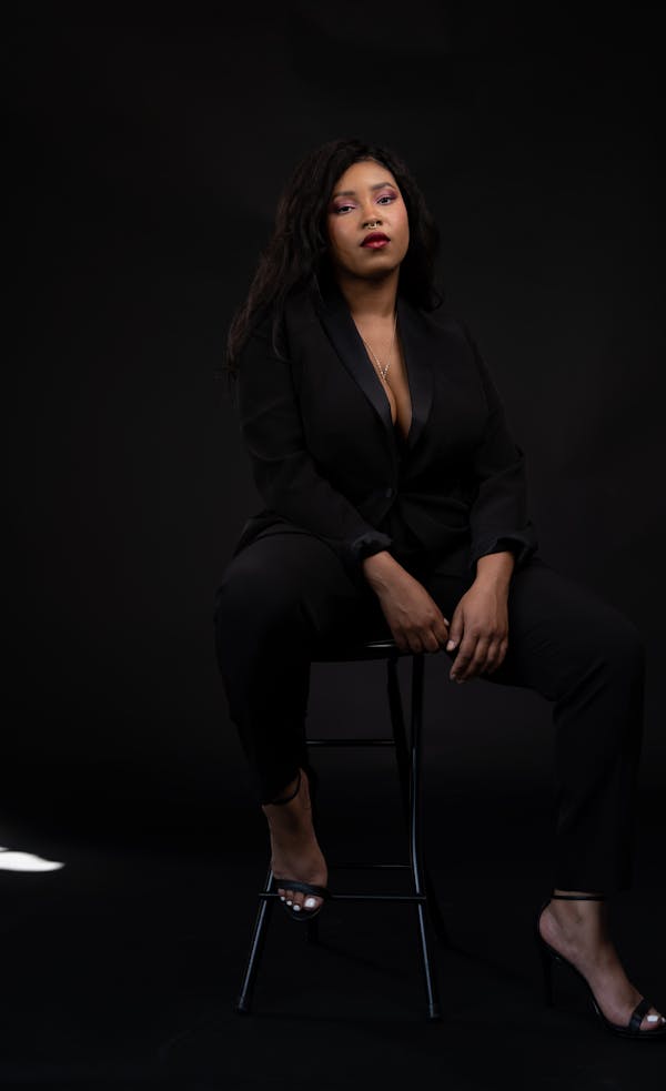 Women's Black Tuxedo on Female Founder of Healthy Roots Dolls, Yelitsa Jean-Charles