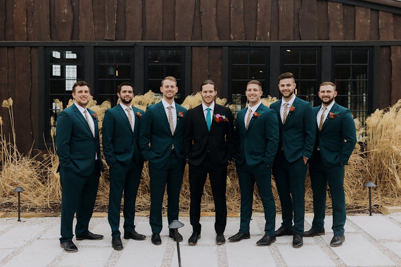 black and teal wedding party suits