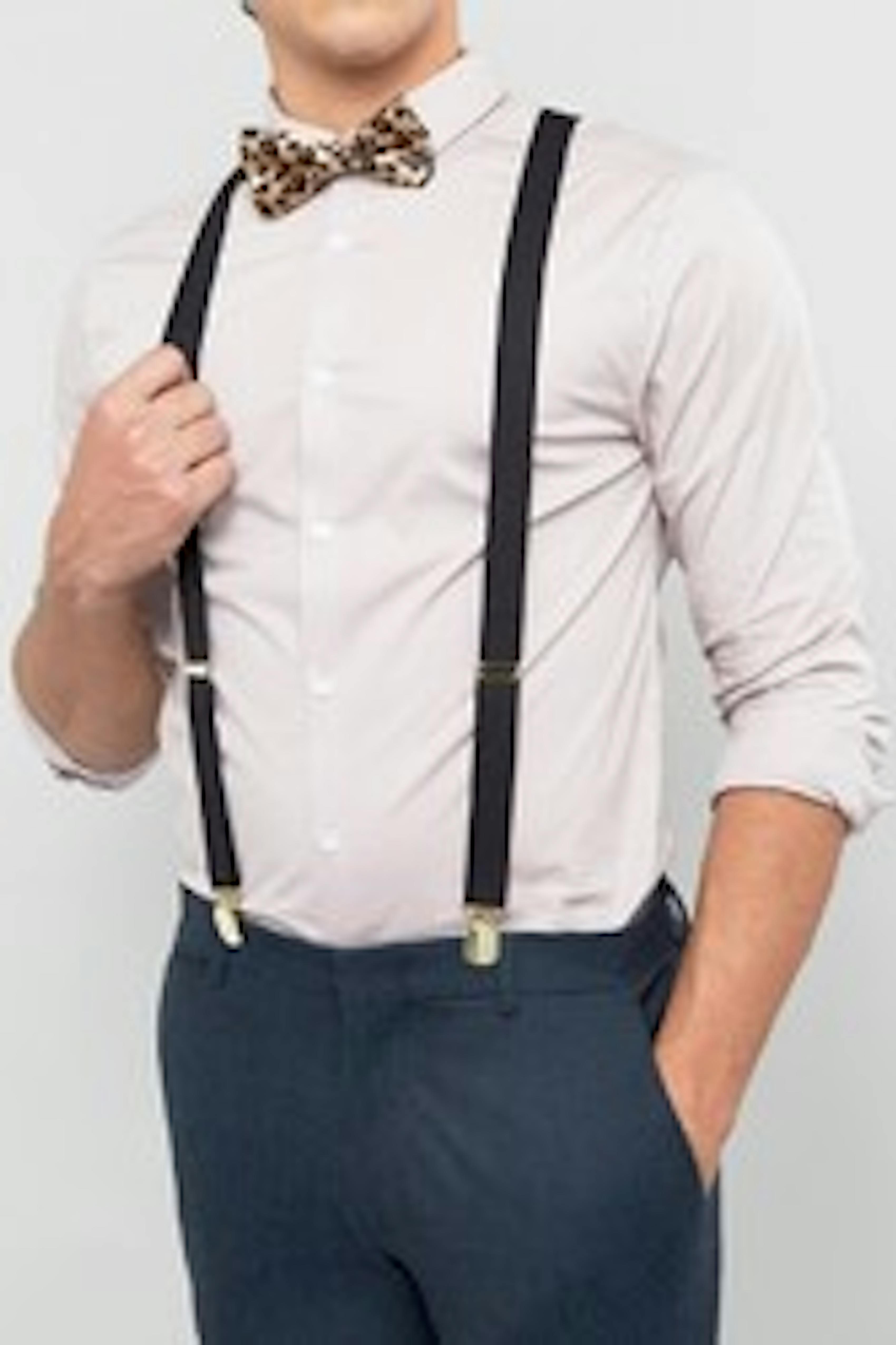 Suit pants and suspenders with cheetah print bow tie for homecoming.