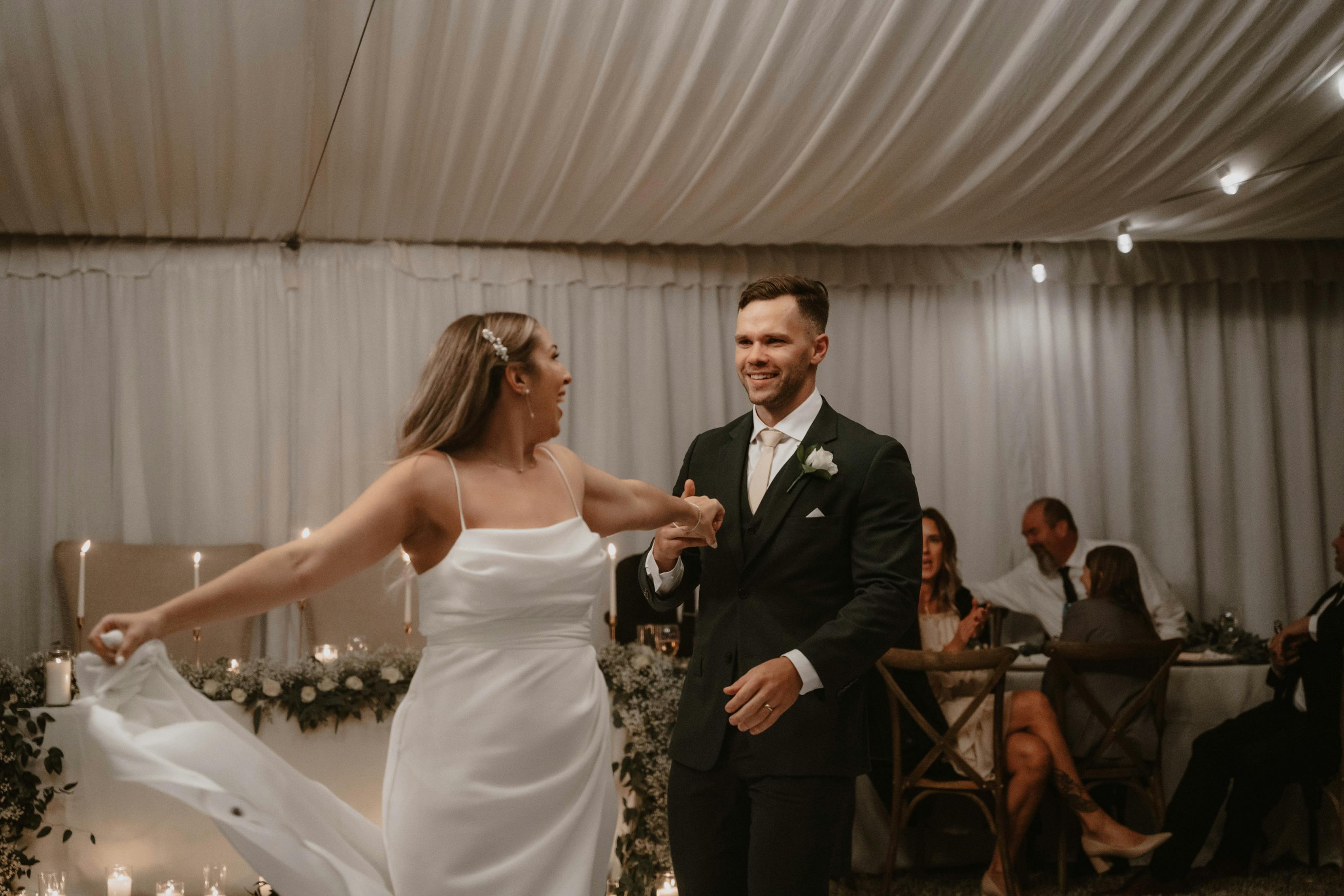 Pearlcore bride and dark green suit groom for first dance.