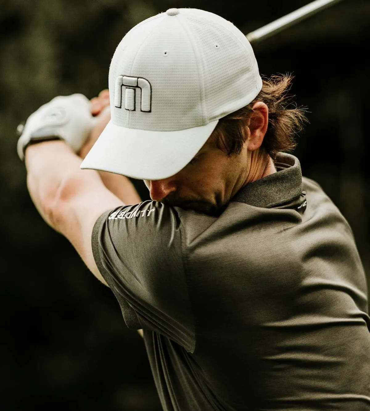 Golfer swinging club