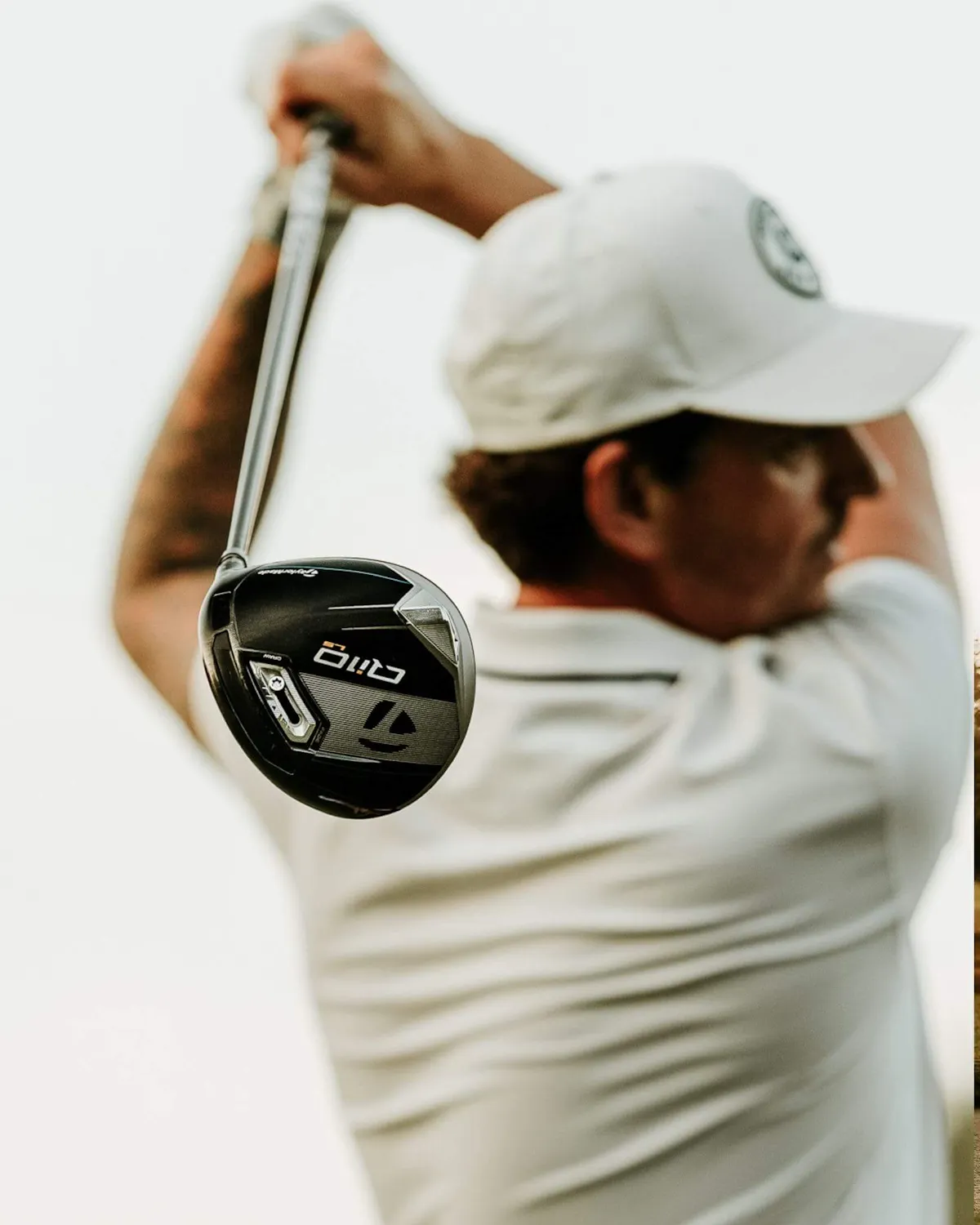 Golfer swinging club