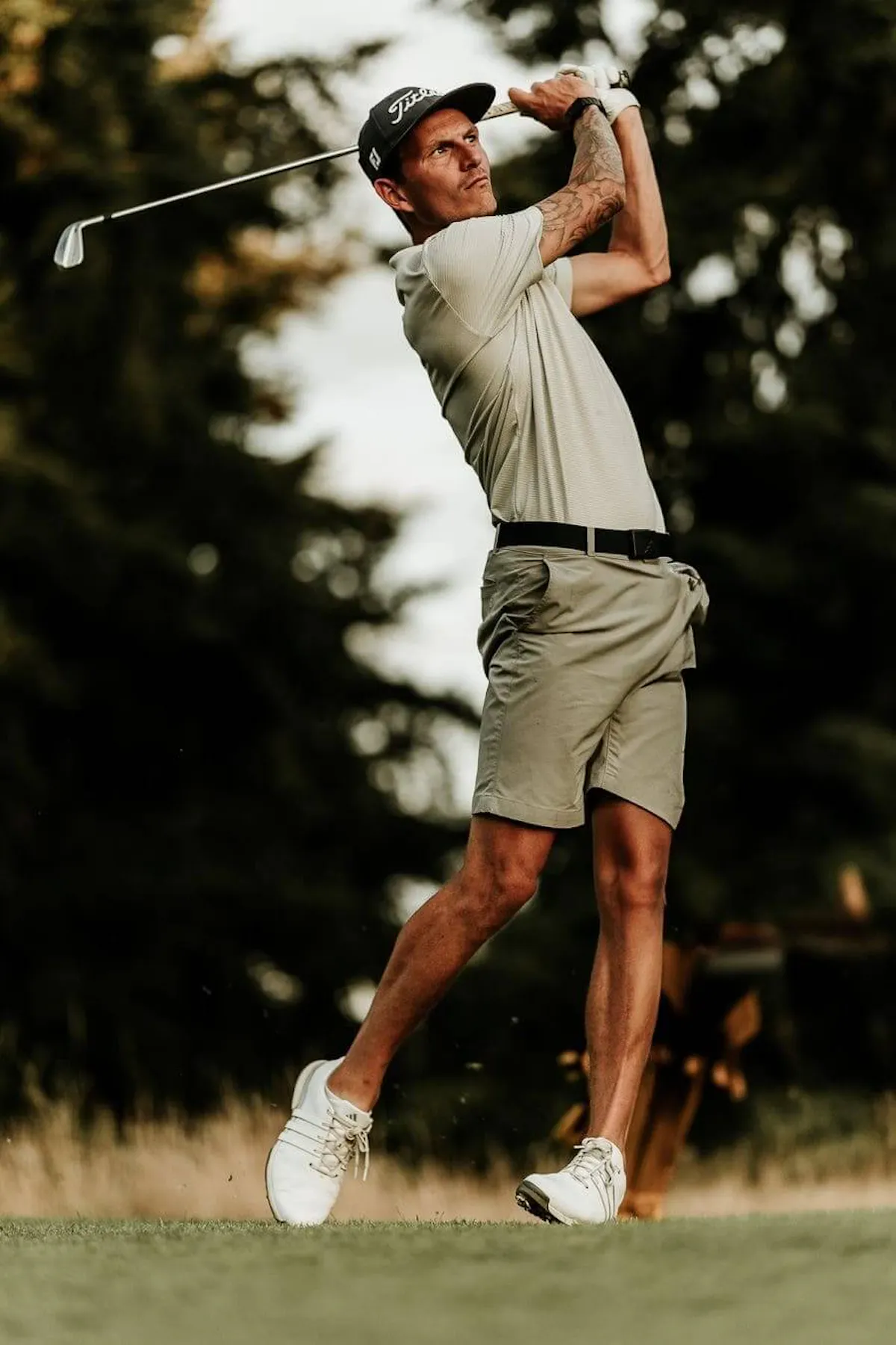 Golfer swinging club