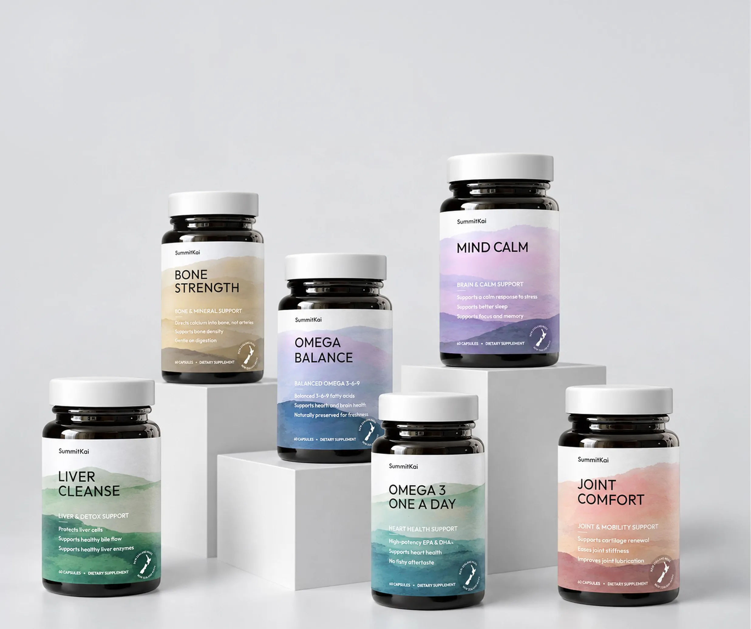 Six SummitKai supplement bottles on white plinths