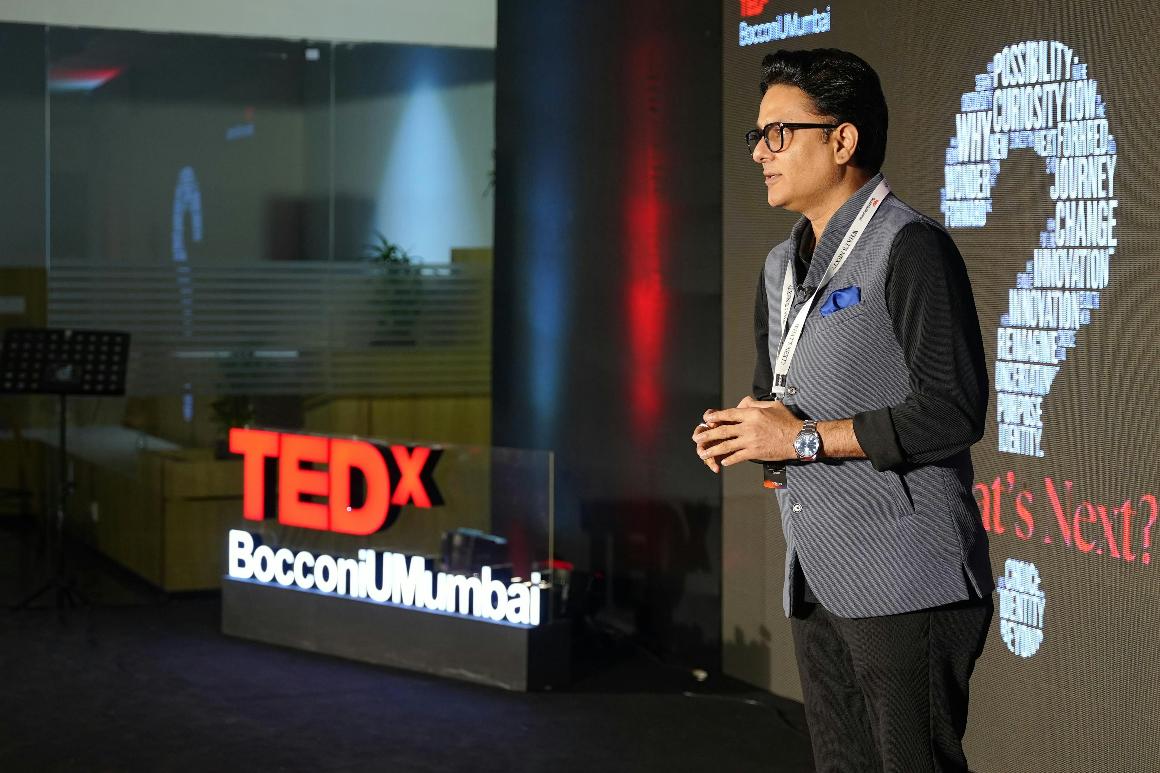 Astrologer Sundeep Kochar delivering a talk on stage at TEDx Bocconi University Mumbai
