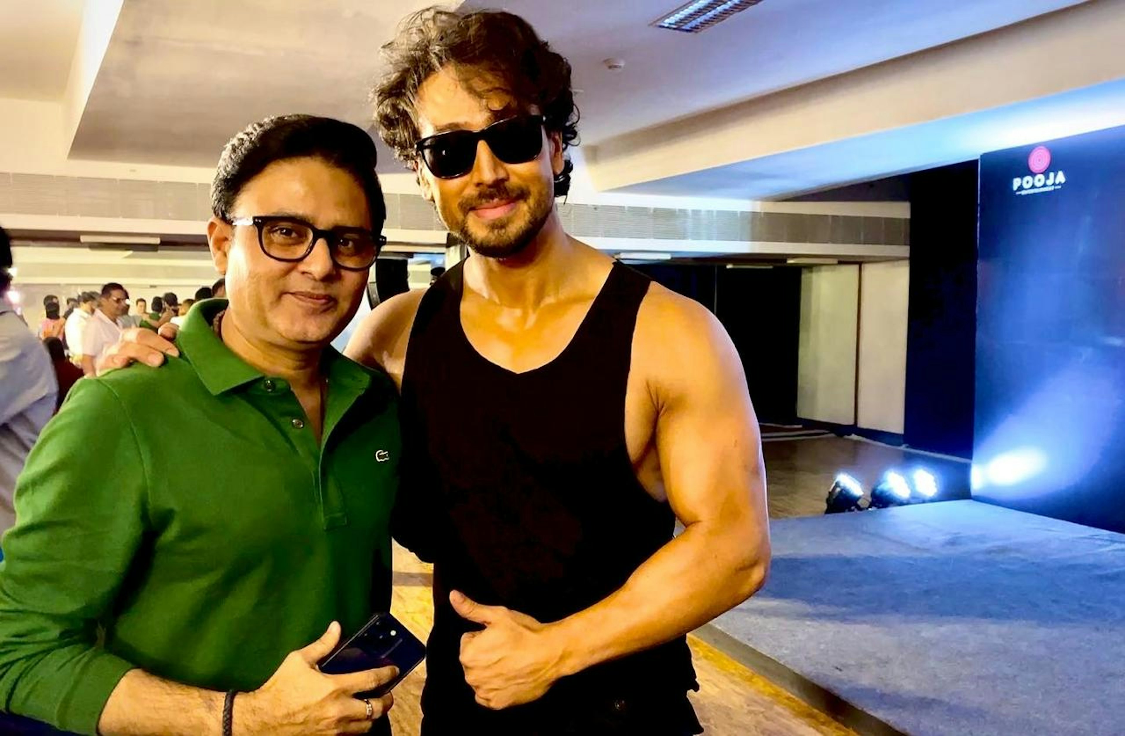 Astrologer Sundeep Kochar posing with Bollywood actor Tiger Shroff at a public event
