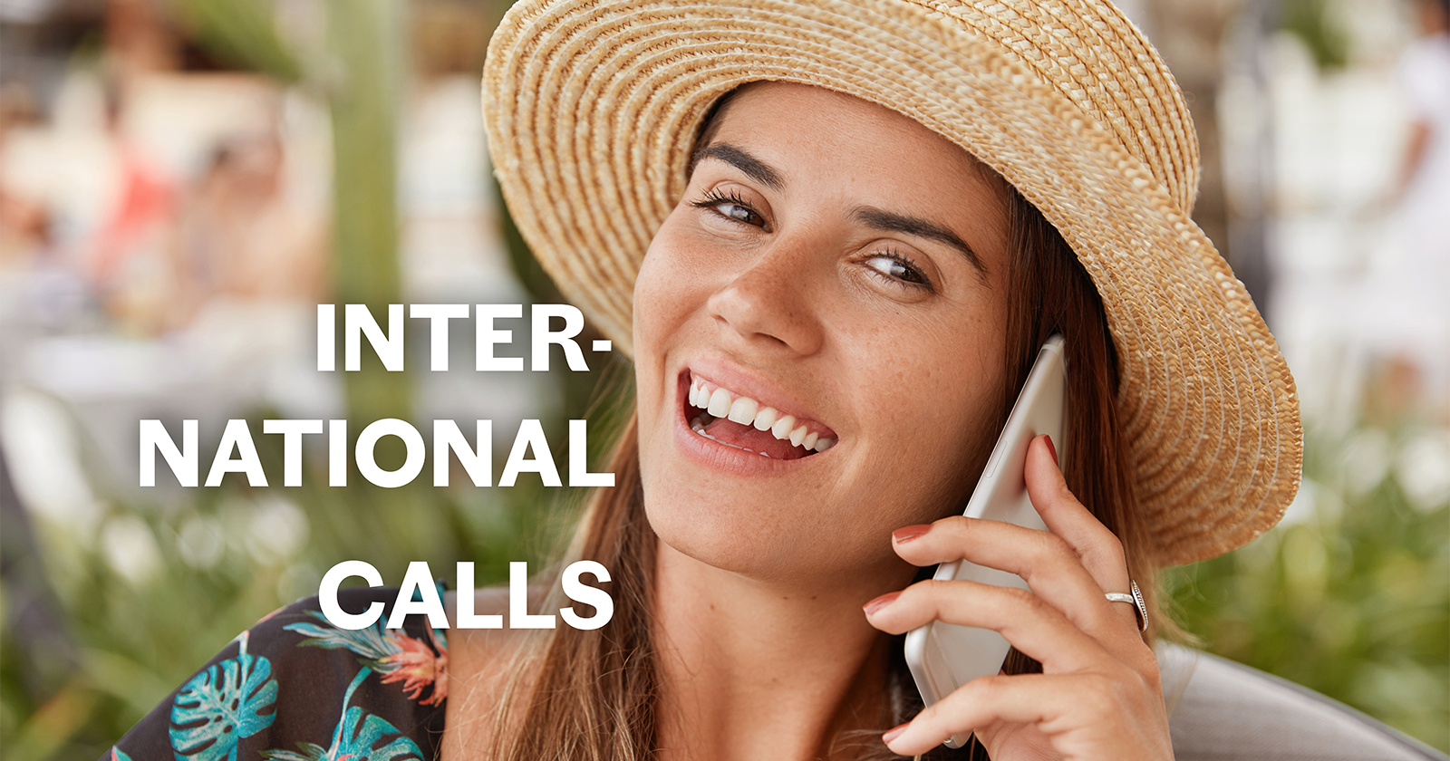 Woman happily talking on her mobile phone