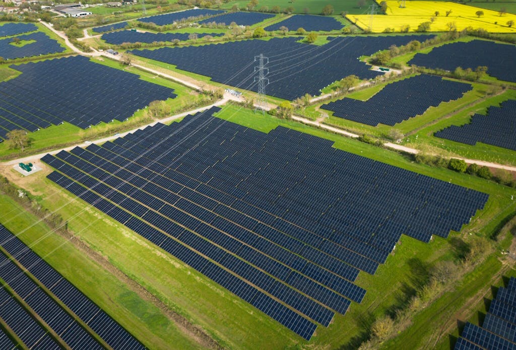 Larks Green Solar Farm. Dozens of solar panels on fields, seen from above