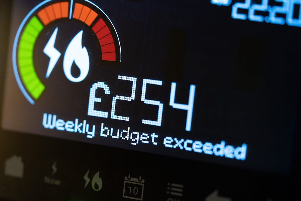 A smart meter showing '£254' above 'Weekly budget exceeded'