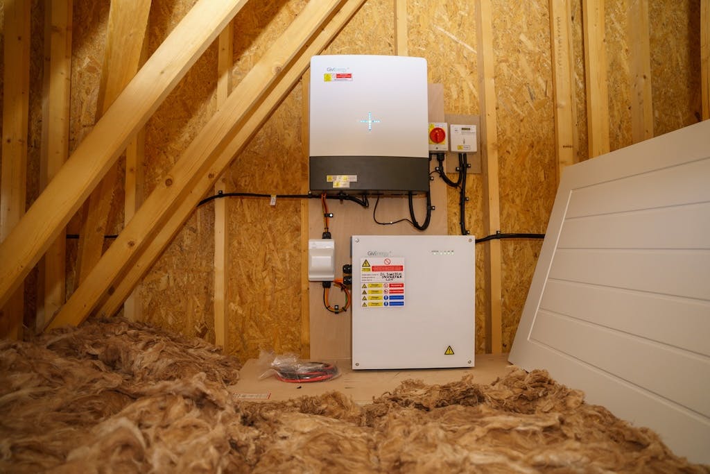 GivEnergy inverter above a GivEnergy storage battery in an attic