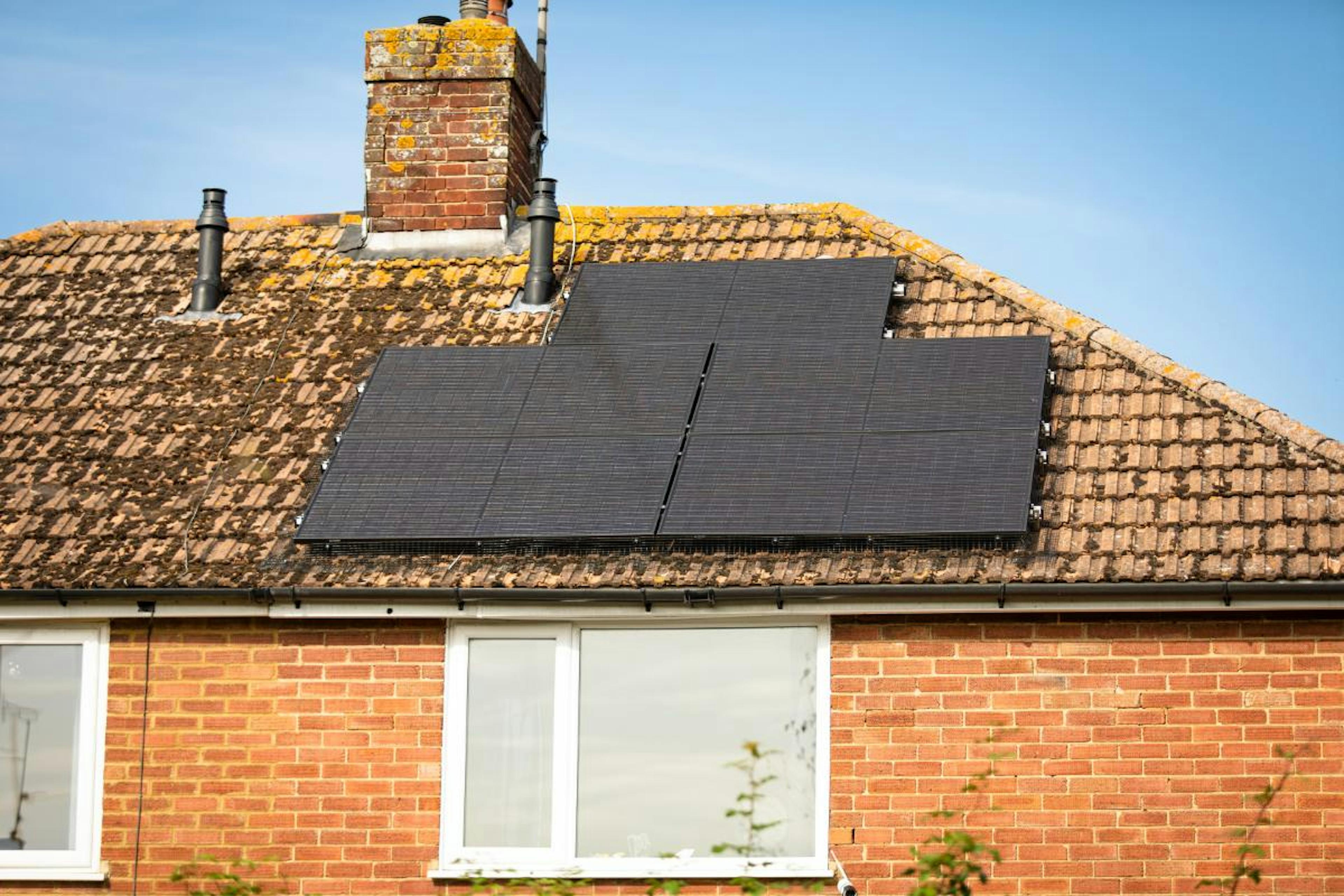 A photo of solar panels with bright light