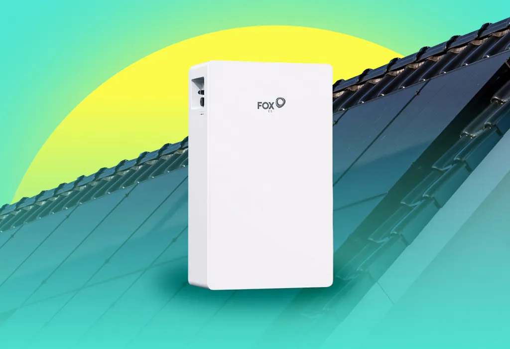 a roof with black solar panels, behind a white battery with 'FOX' printed on it, all against a yellow sun and an aquamarine background