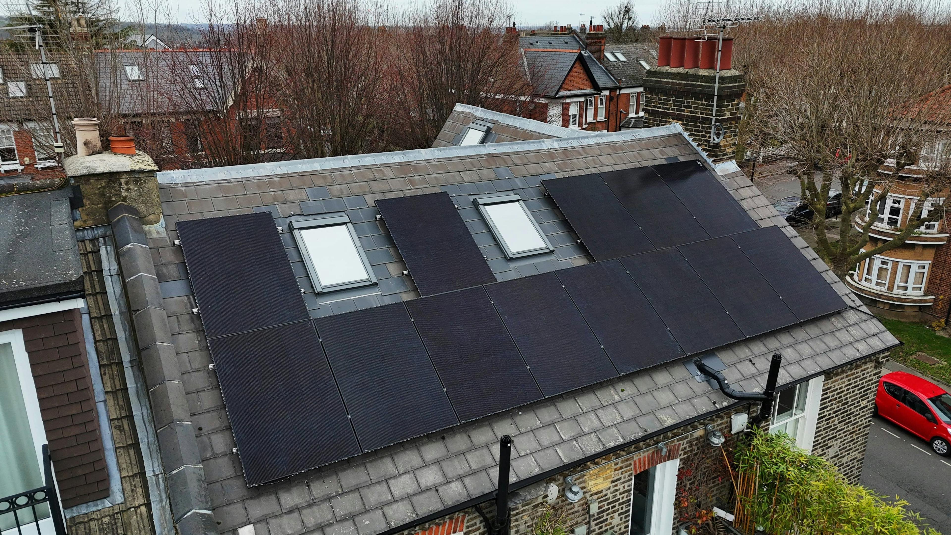 black solar panels on a grey roof