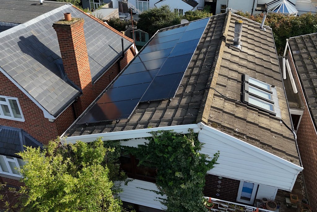 black solar panels on a brown roof