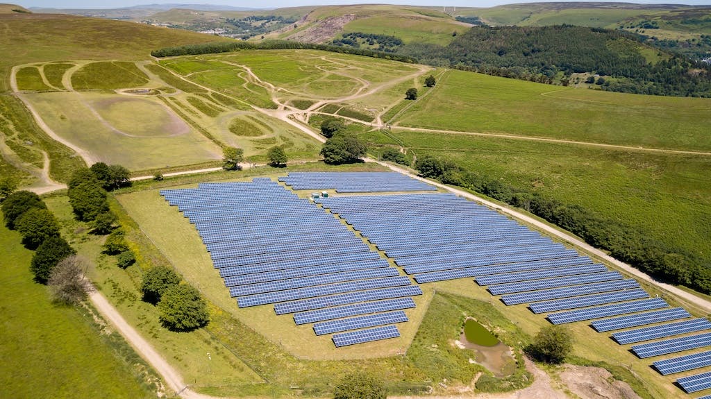 Aerial shot of a large solar farm in rural south Wales