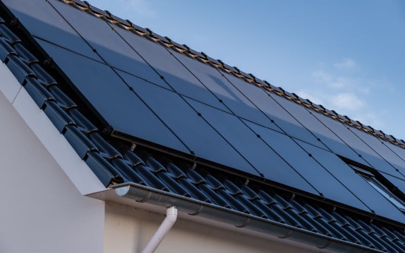 Modern all black solar panels installed on a house