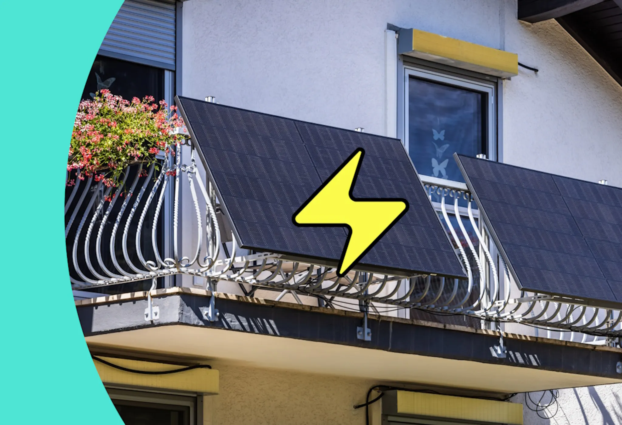 Black solar panels on a white balcony, connected to a home