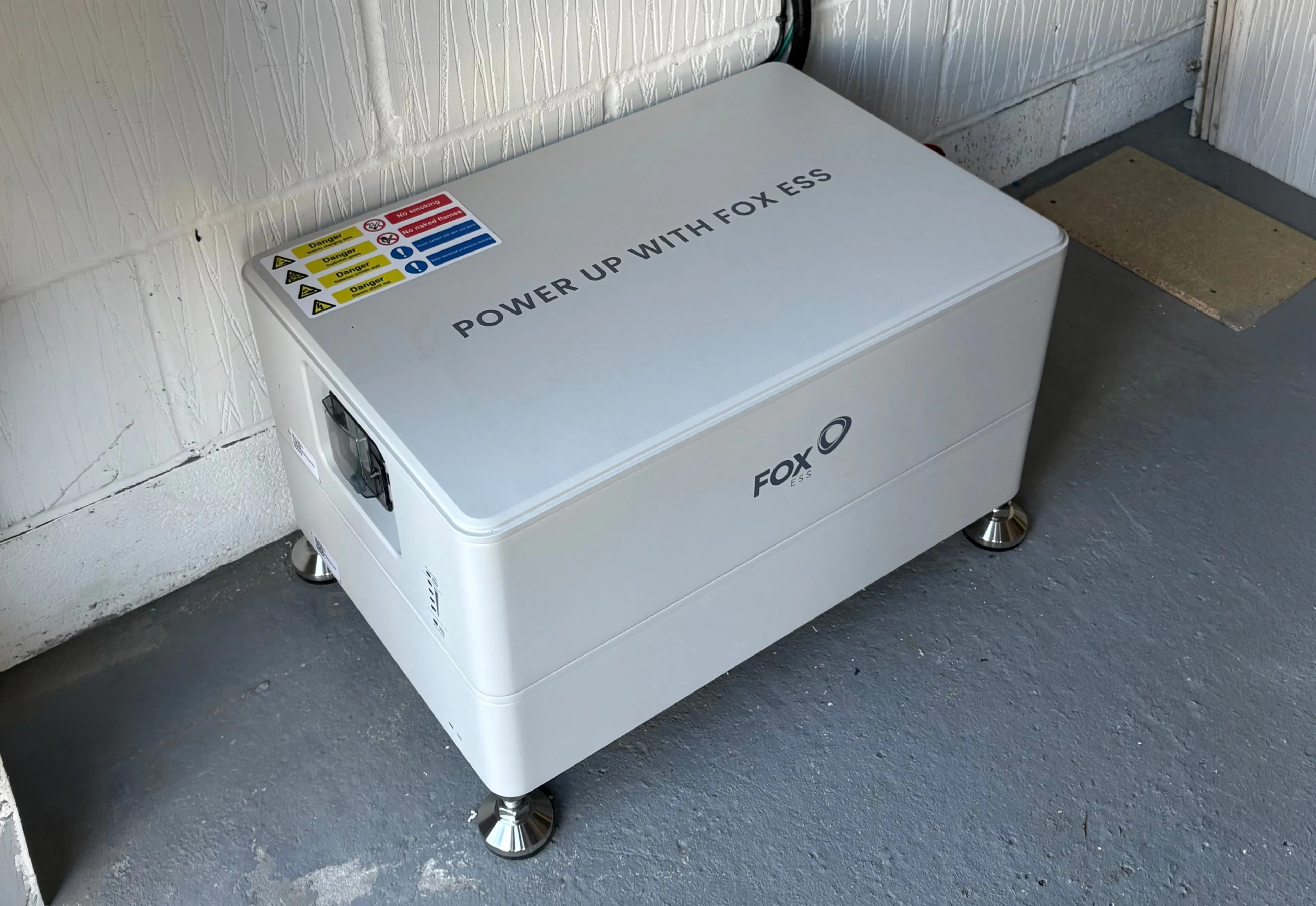 a white Fox ESS battery in a garage