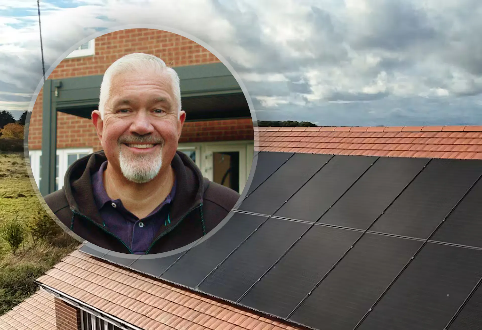 Tony in a circle in front of his roof, which has black solar panels