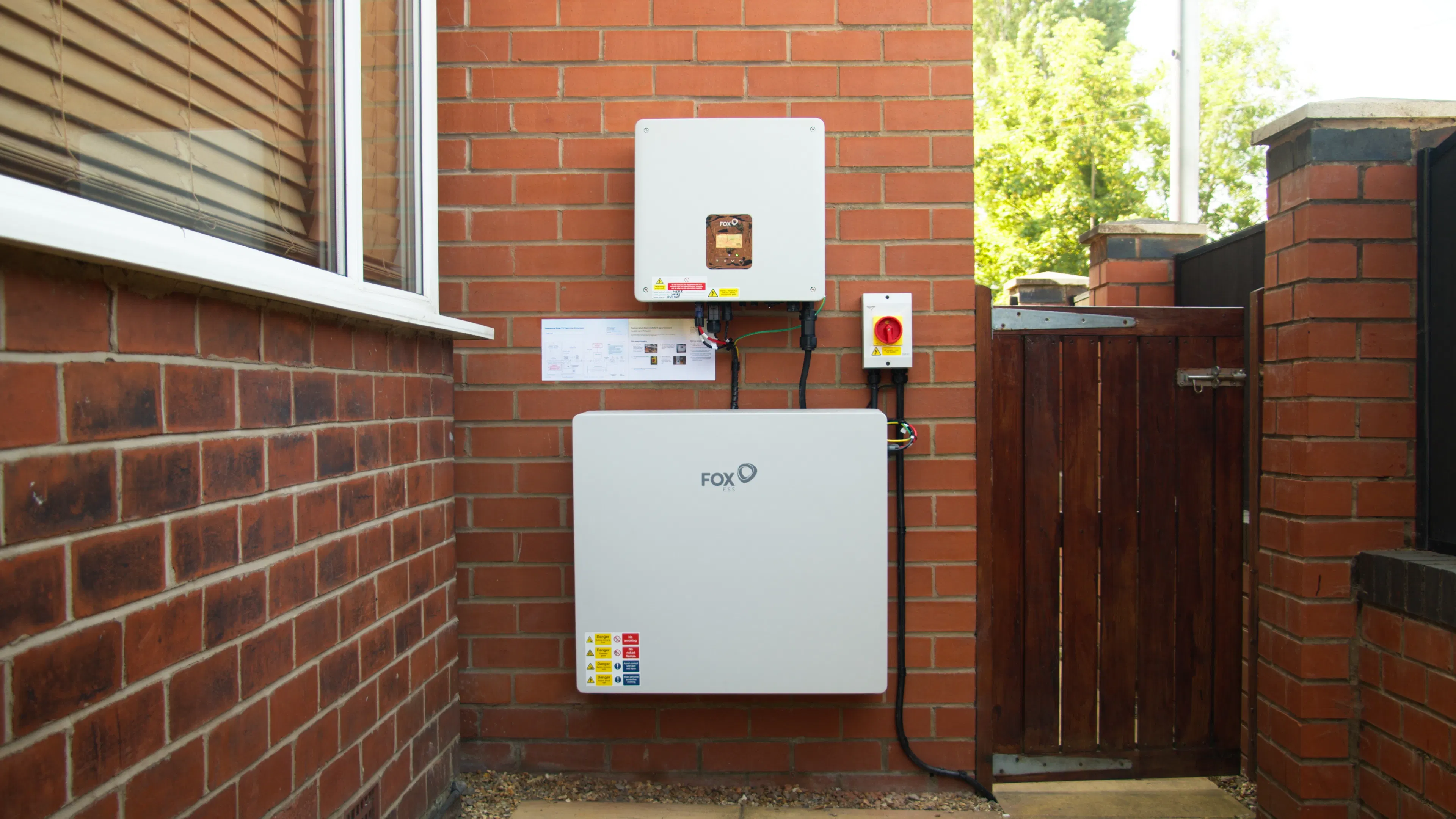 Photo of a home battery on a customer's wall