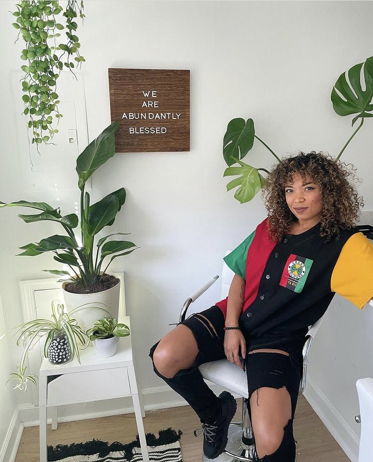 Monica at home with a few of her plants.